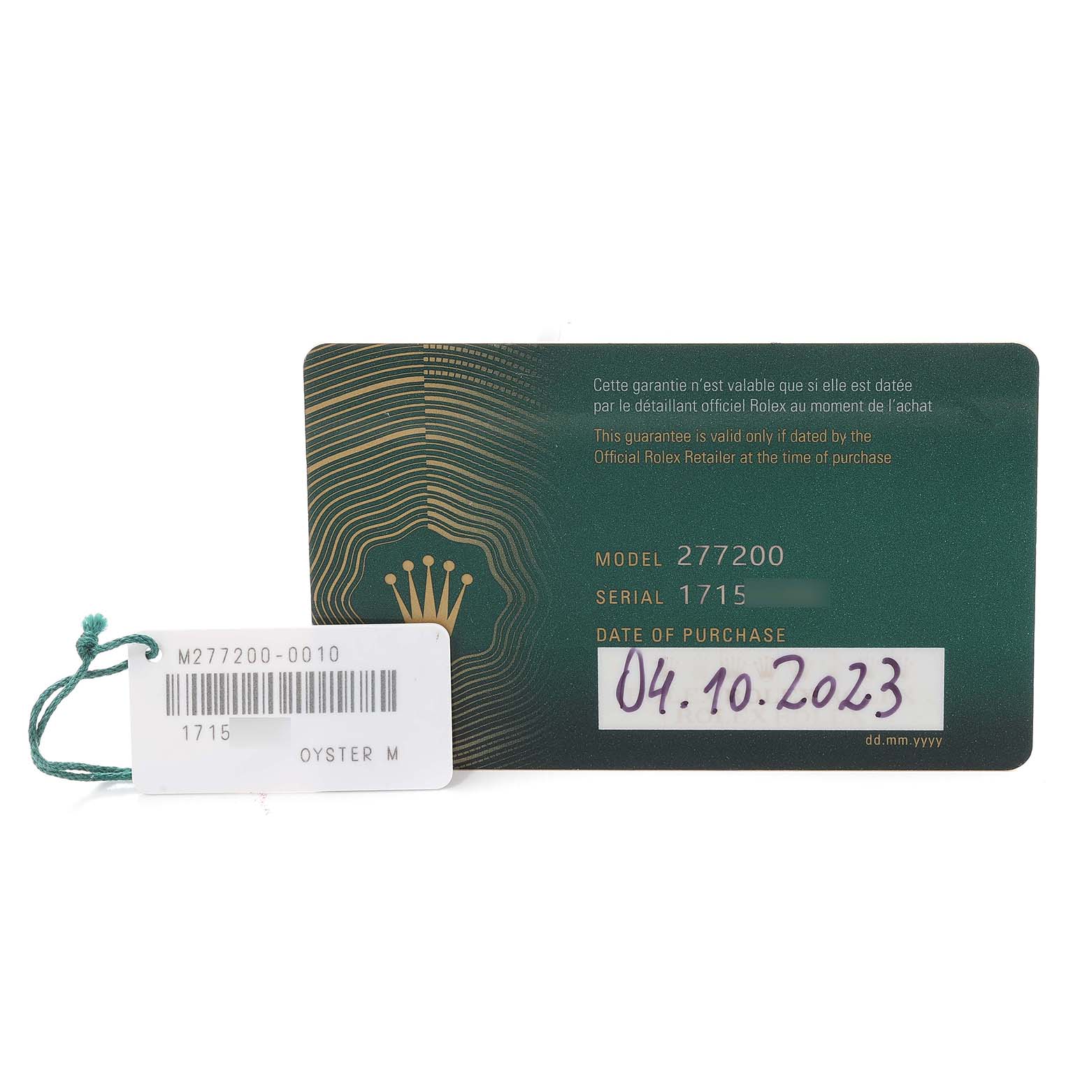 The image shows the guarantee card and tag for a mid-size Rolex watch, model 277200, with the purchase date listed.