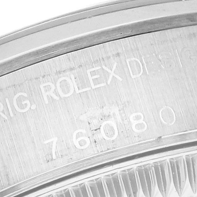 This image shows a close-up of the engraved inner bezel of the Rolex Oyster Perpetual 76080 Women
s Stainless Steel Pink Dial 76080 Women
s Stainless Steel Pink Dial watch.