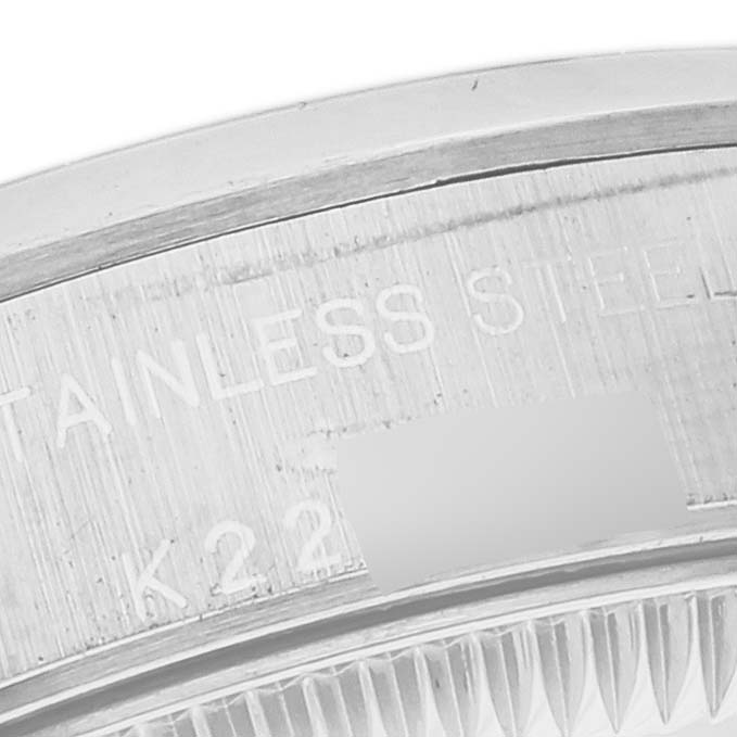 This image shows a close-up of the engraved case back underside of a Rolex Oyster Perpetual 76080 Women
s Stainless Steel Pink Dial 76080 Women
s Stainless Steel Pink Dial watch.