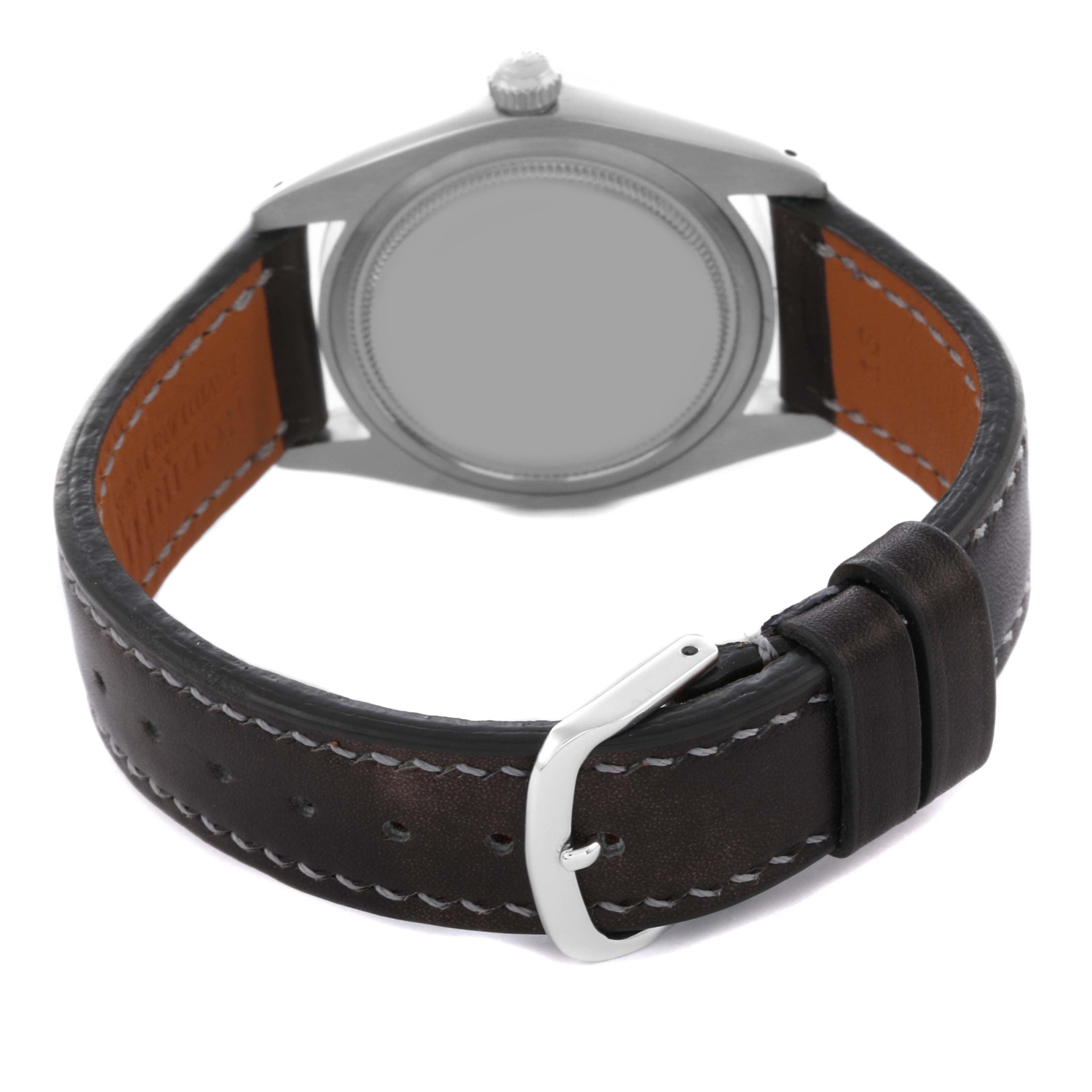 The image shows the back side of a Rolex Vintage Collection 6694 Men's Stainless Steel Black Dial 6694 Men's Stainless Steel Black Dial watch, focusing on the case and leather strap with buckle.