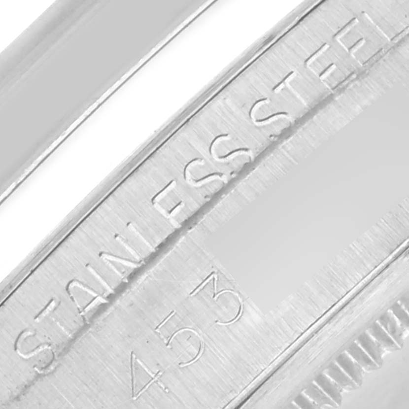 The close-up image shows the engraved "STAINLESS STEEL" part of the case back of a Rolex Vintage Collection 6694 Men's Stainless Steel Black Dial 6694 Men's Stainless Steel Black Dial watch.