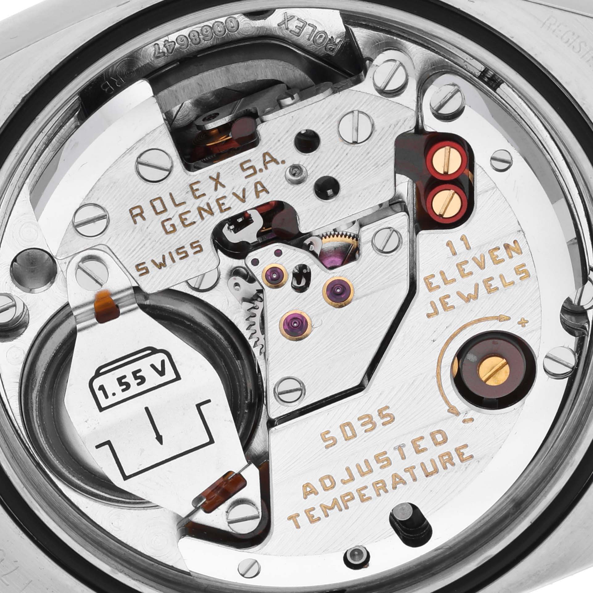 The image shows the Rolex Oysterquartz 17013 Men's Steel and Gold (two tone) Champagne Dial 17013 Men's Steel and Gold (two tone) Champagne Dial watch movement from a top-down angle, displaying its intricate components and jewels.