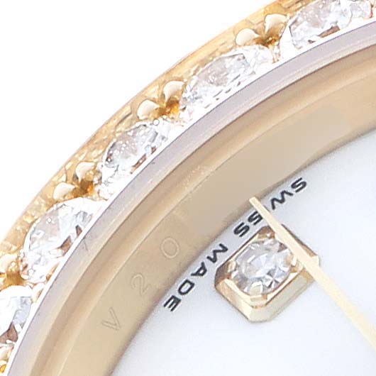 The image shows a close-up of the Rolex Pearlmaster 80298 Women's Yellow Gold White Dial bezel encrusted with diamonds and part of the watch face with a "Swiss Made" marking.