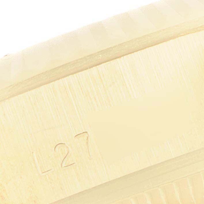 The image shows a close-up of the President model by Rolex, focusing on the case side with the serial number engraved.