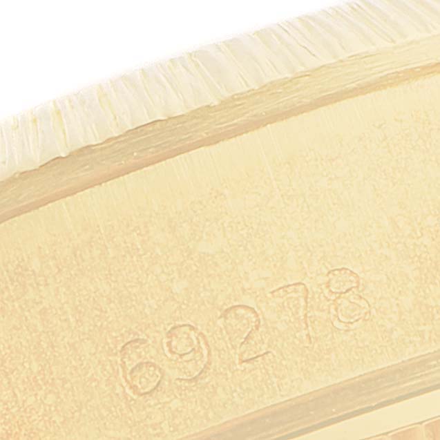 This close-up image shows the engraved model number on the case of the Rolex President 69278 Women's Yellow Gold Champagne Dial 69278 Women's Yellow Gold Champagne Dial watch.