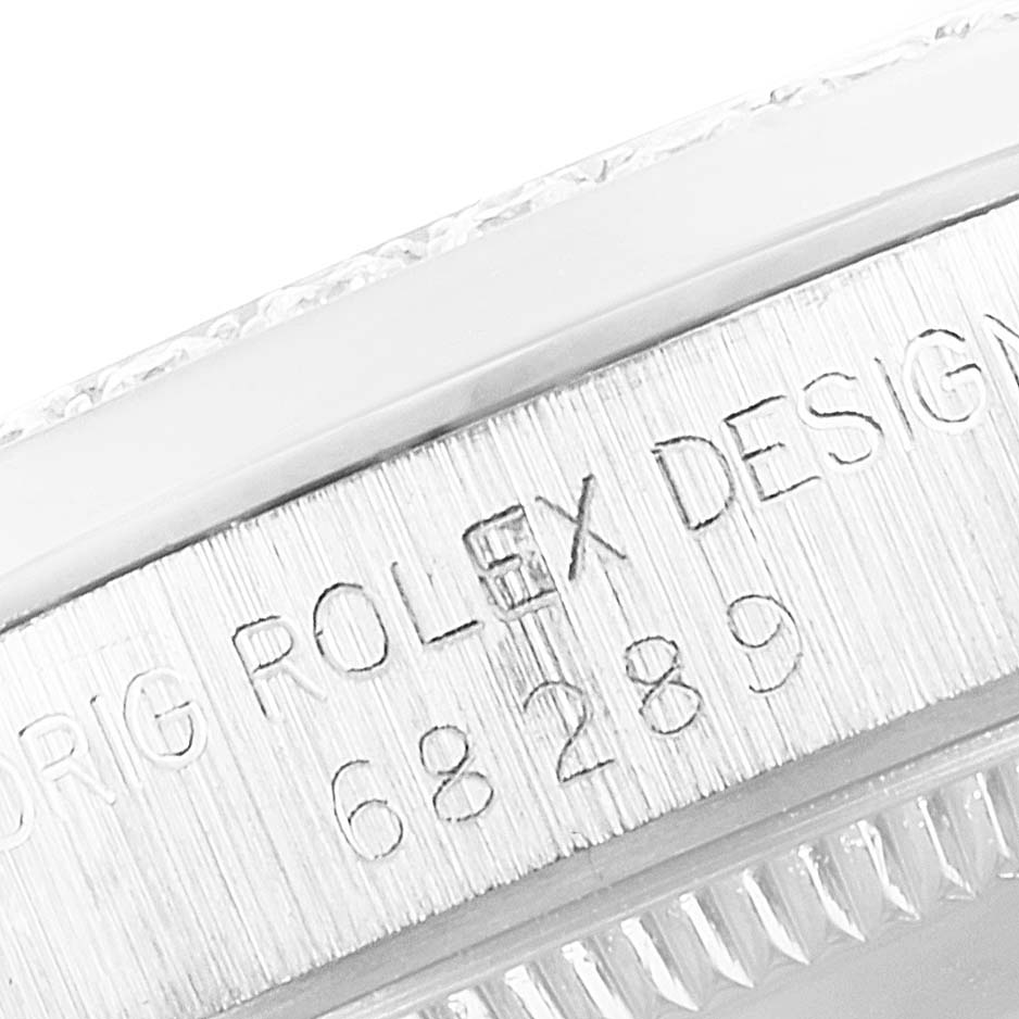 The image shows a close-up of the Rolex President 68289 Women's White Gold Silver Dial 68289 Women's White Gold Silver Dial model case, highlighting the engraved text and serial number.