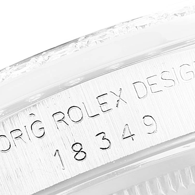 The image shows a close-up angle of the serial number engraved on the case of a Rolex President 18349 Men's White Gold Silver Dial 18349 Men's White Gold Silver Dial model watch.