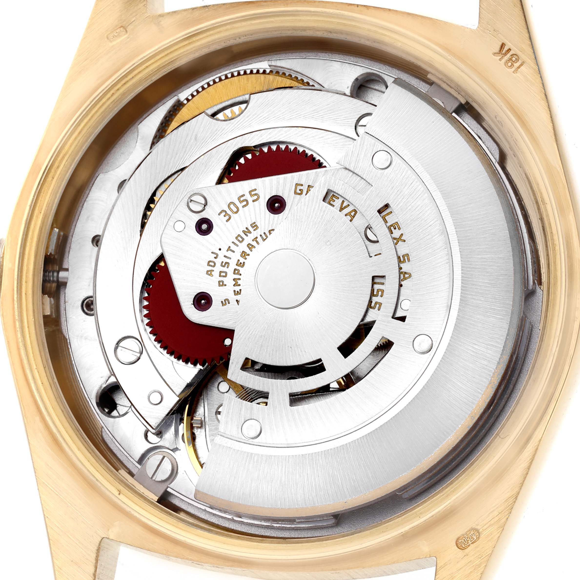 The image shows the exposed movement of a Rolex President 18038 Men's Yellow Gold Silver Dial watch, viewed from the back, highlighting its internal components.