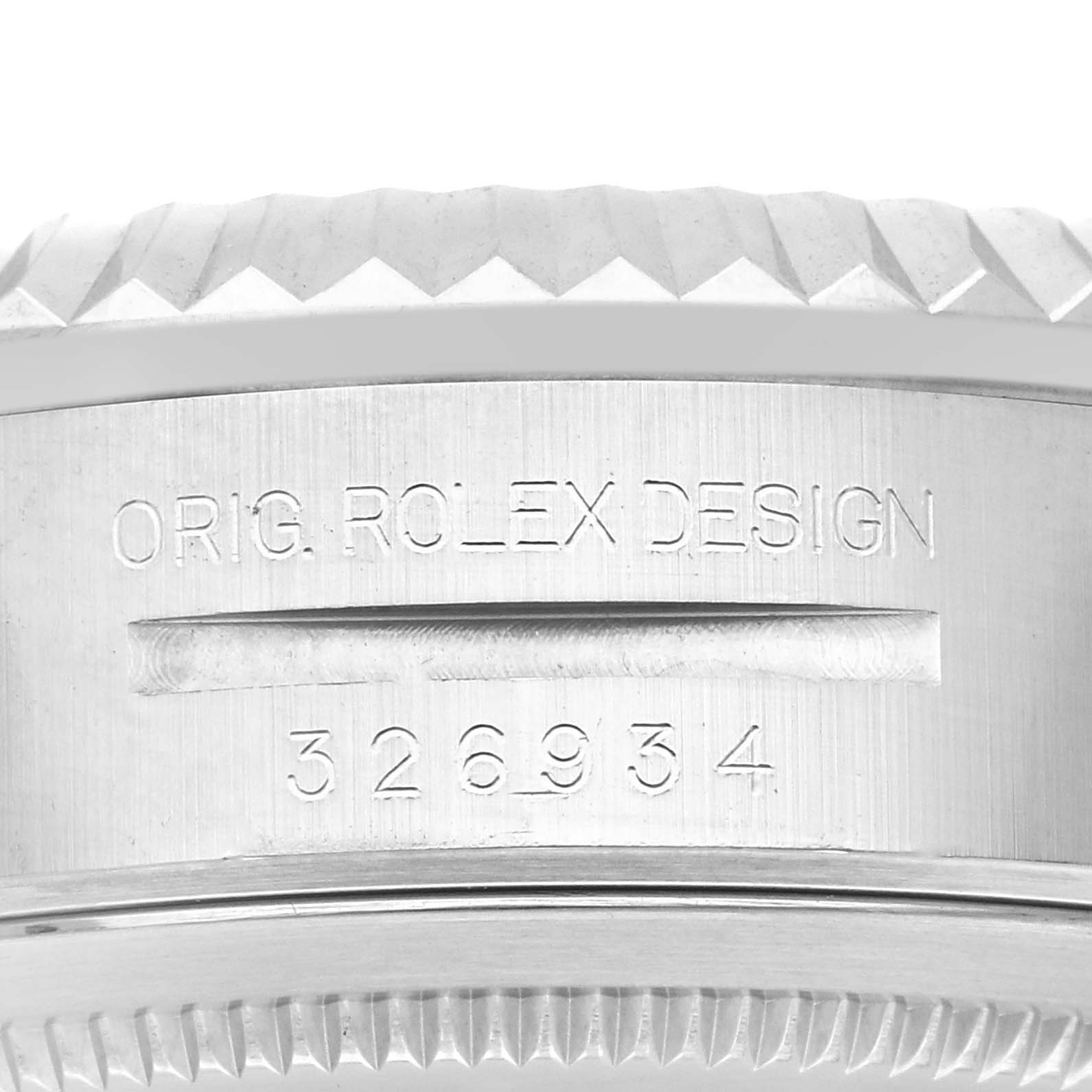 The close-up image shows the engraved side of the Rolex Sky-Dweller 326934 Men's Stainless Steel Blue Dial 326934 Men's Stainless Steel Blue Dial's bezel with model number "326934".