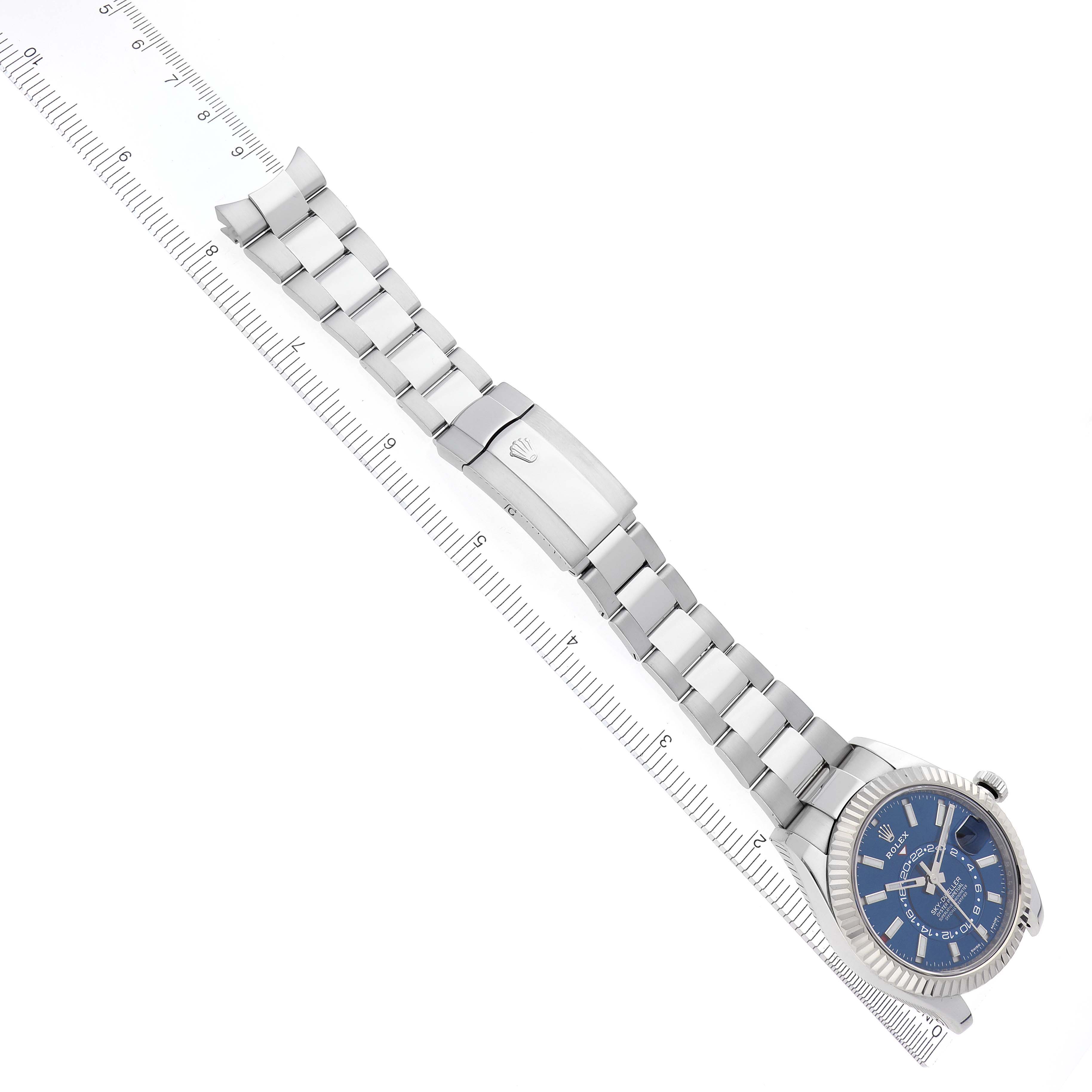 The Rolex Sky-Dweller 326934 Men's Stainless Steel Blue Dial 326934 Men's Stainless Steel Blue Dial watch is shown from above, highlighting its blue dial and full bracelet with clasp.