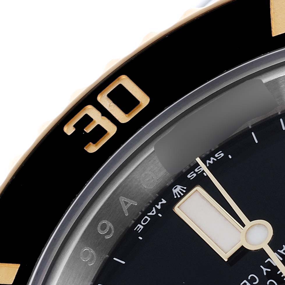 This close-up image shows the bezel and dial partially, including the "30" marking, of the Rolex Submariner 126613 Men's Steel and Gold (two tone) Black Dial 126613 Men's Steel and Gold (two tone) Black Dial watch.