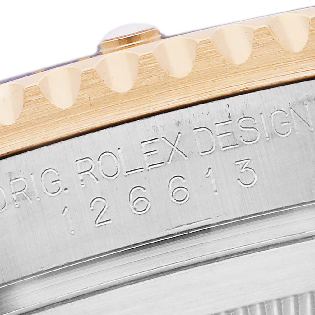 This image shows a close-up of the engraved side of a Rolex Submariner 126613 Men's Steel and Gold (two tone) Black Dial 126613 Men's Steel and Gold (two tone) Black Dial, highlighting the model number.
