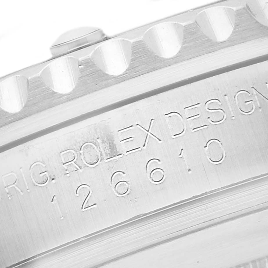 The image shows a close-up of the Rolex Submariner 126610LN Men's Stainless Steel Black Dial 126610LN Men's Stainless Steel Black Dial's engraved side and bezel teeth.