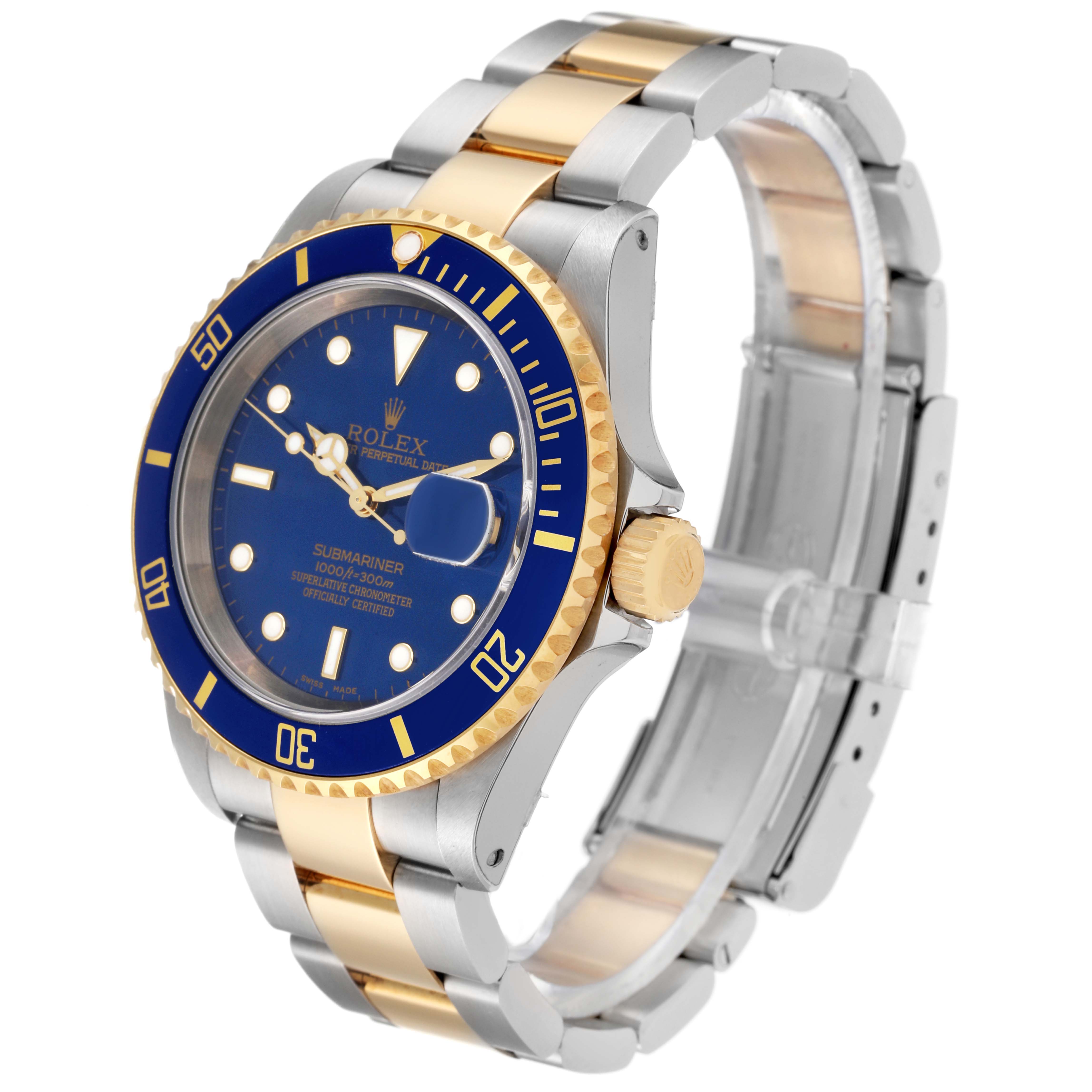 The image shows a Rolex Submariner 16613 Men
s Steel and Gold (two tone) Blue Dial 16613 Men
s Steel and Gold (two tone) Blue Dial watch at an angle highlighting its blue dial, bezel, and two-tone bracelet.