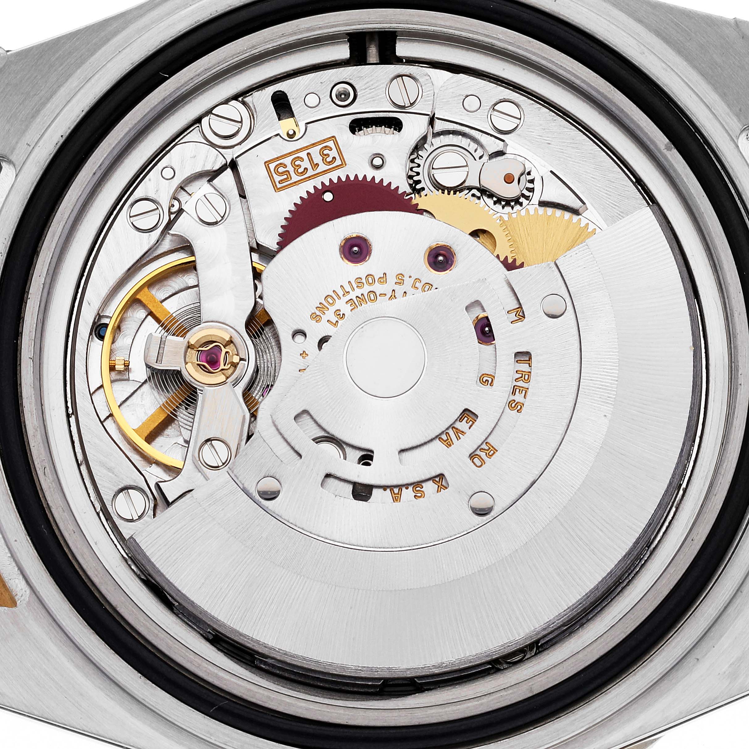 This image shows the internal mechanism of the Rolex Submariner 16613 Men
s Steel and Gold (two tone) Blue Dial 16613 Men
s Steel and Gold (two tone) Blue Dial watch, focusing on the movement from a back angle.