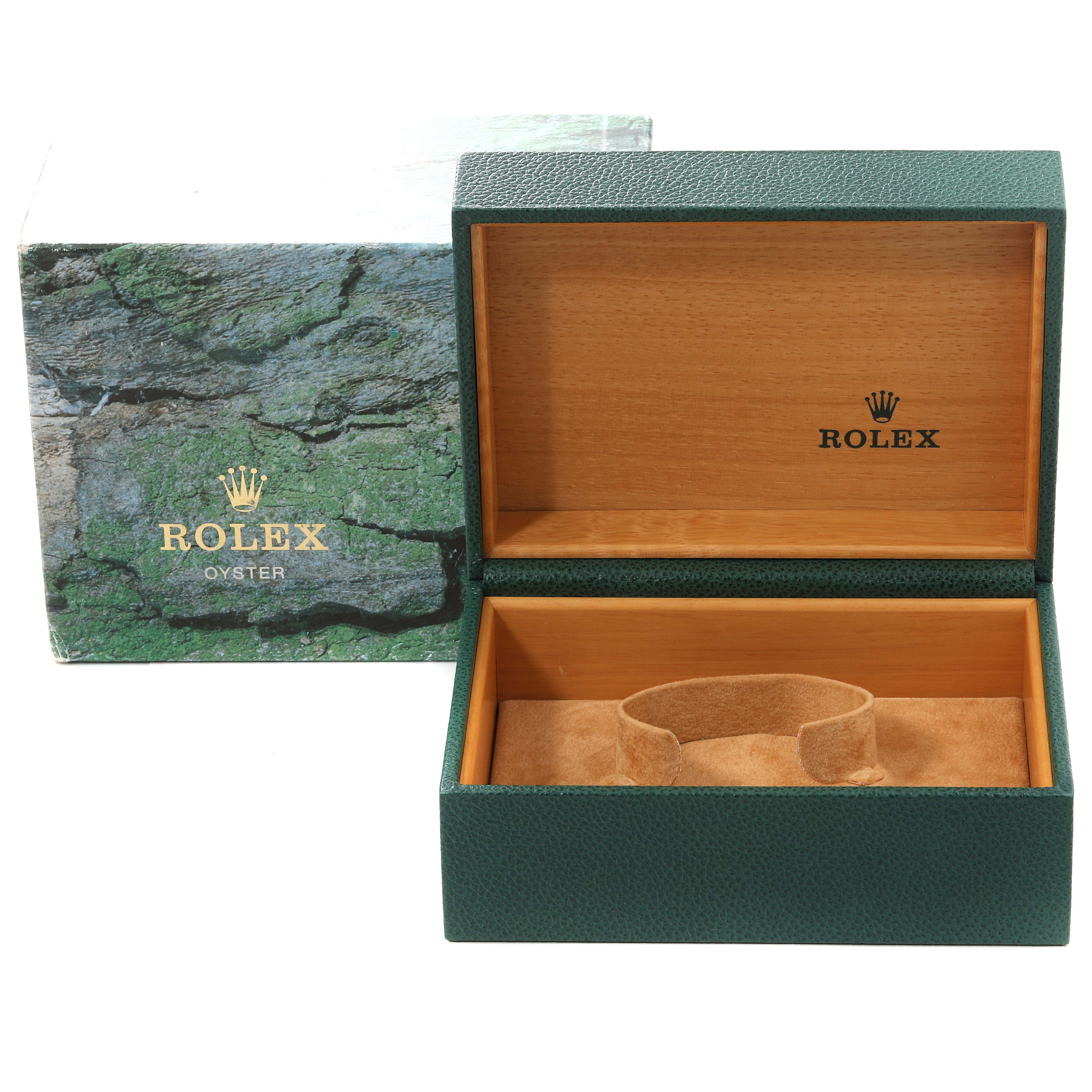 The image shows an open green presentation box and an outer box for a Rolex Submariner 16613 Men
s Steel and Gold (two tone) Blue Dial 16613 Men
s Steel and Gold (two tone) Blue Dial watch.