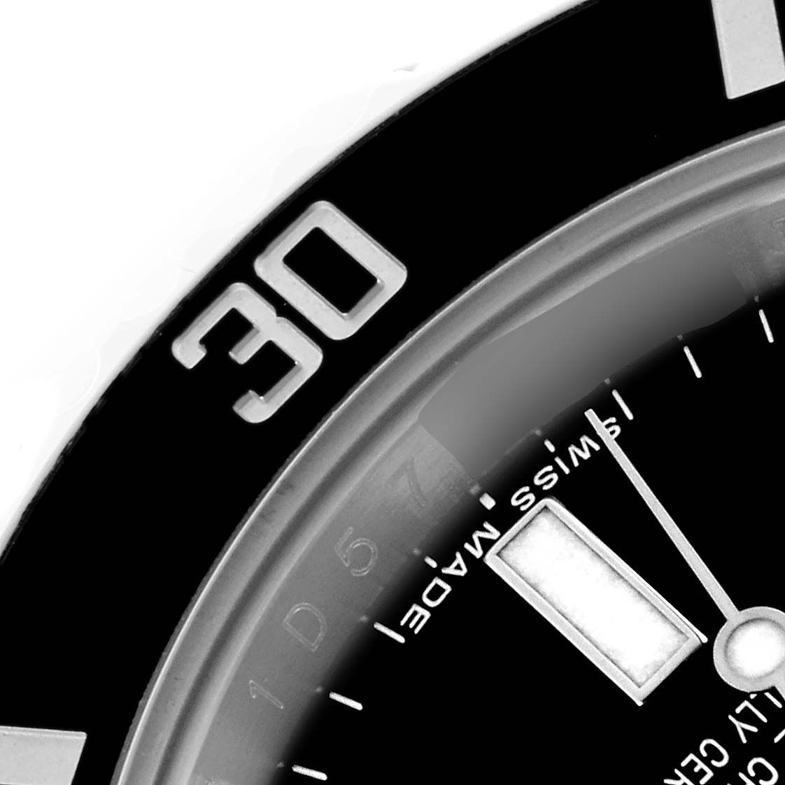 The image shows a close-up of the bezel and part of the dial of a Rolex Submariner 114060 Men's Stainless Steel Black Dial 114060 Men's Stainless Steel Black Dial, focusing on the 30-minute marker.