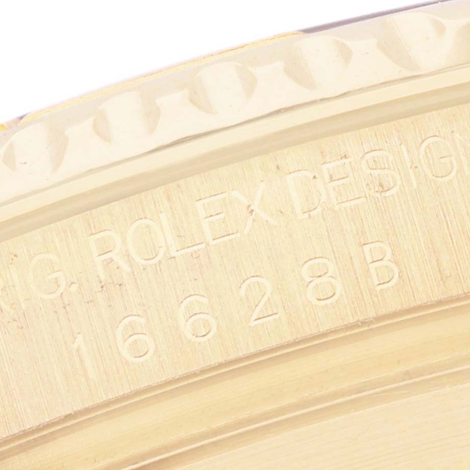 The image shows a close-up of the Rolex Yacht-Master 16628 Men
s Yellow Gold White Dial 16628 Men
s Yellow Gold White Dial
s side, highlighting the bezel edging and engraved model details.