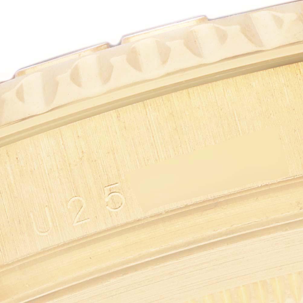 The image shows a close-up of the bezel and case edge of a Rolex Yacht-Master 16628 Men
s Yellow Gold White Dial 16628 Men
s Yellow Gold White Dial.