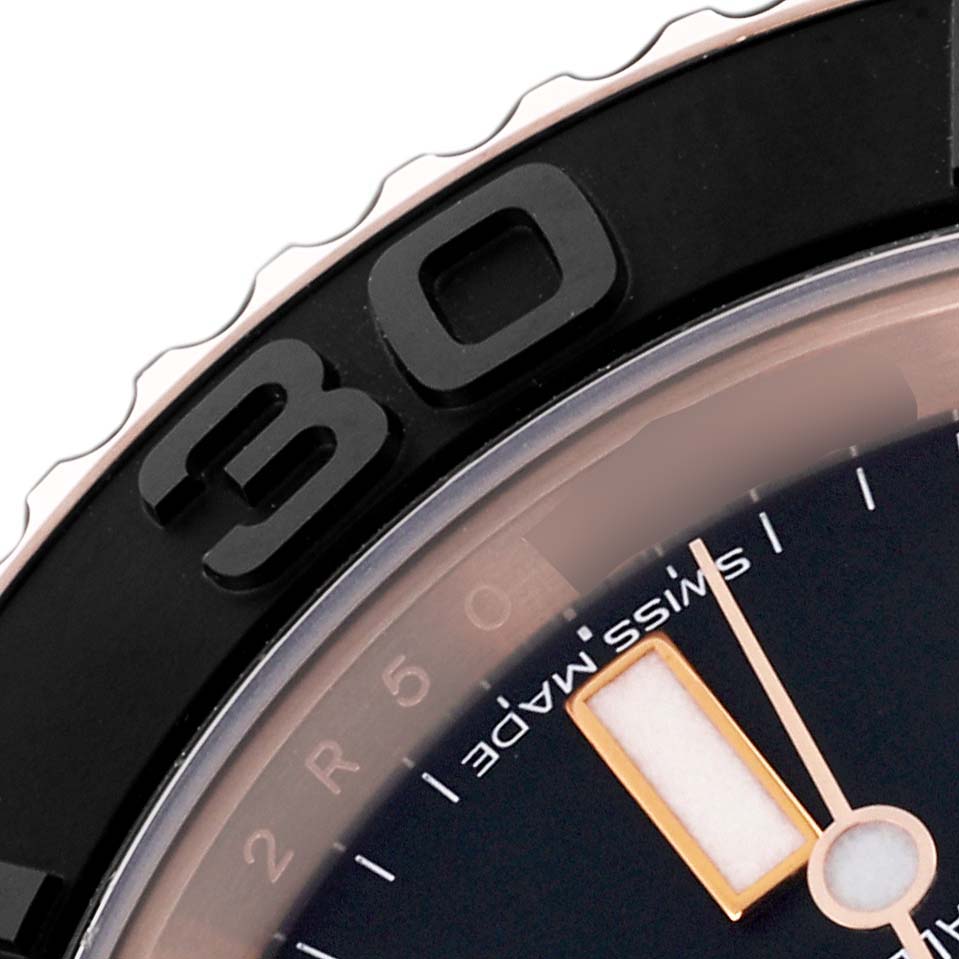 This close-up shows the bezel, dial, and hand of the Rolex Yacht-Master 116655 Men's Rose Gold Black Dial 116655 Men's Rose Gold Black Dial, highlighting the "30" marker and part of the minute hand.