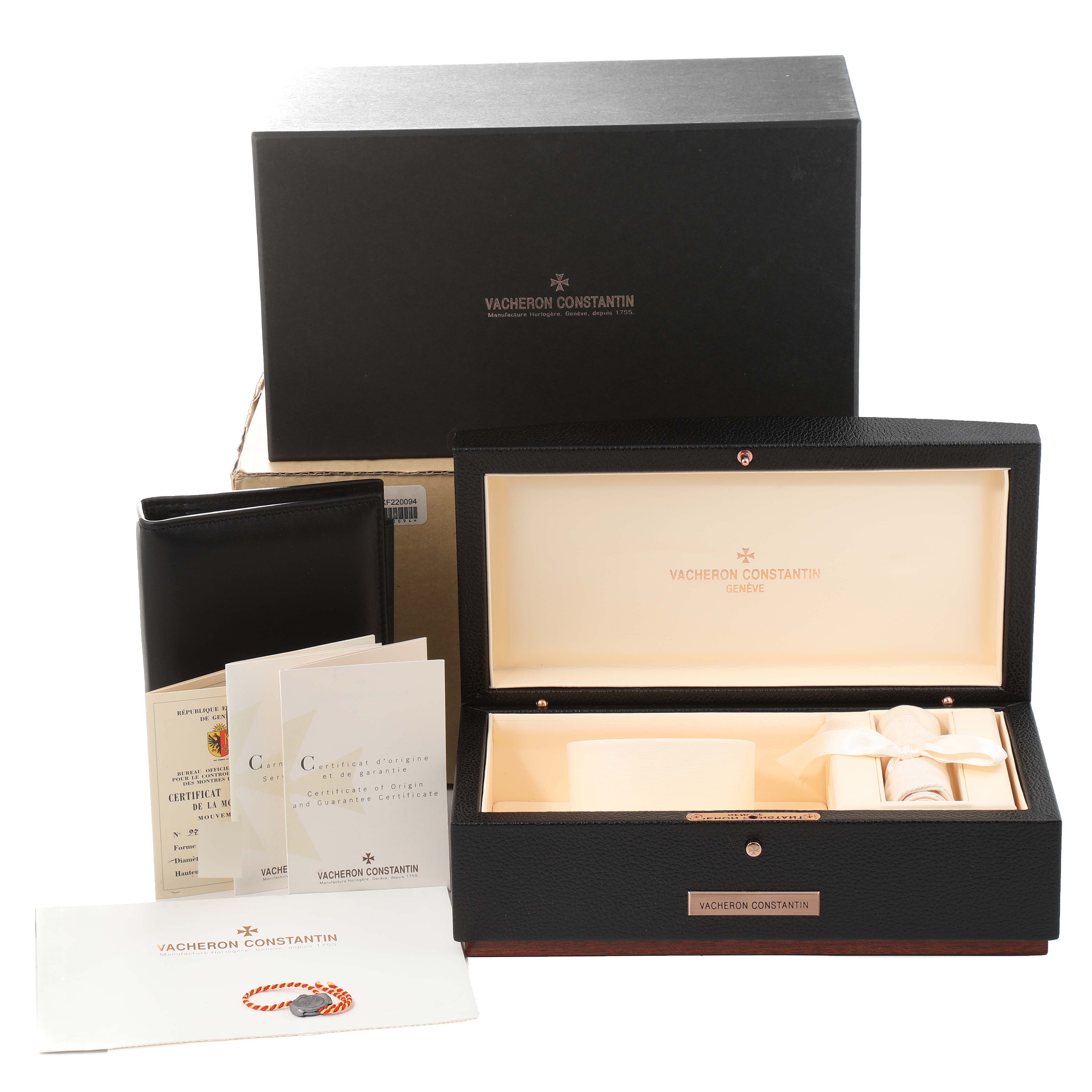 This image shows a Vacheron Constantin Patrimony 81180/000G Men's White Gold Silver Dial 81180/000G Men's White Gold Silver Dial watch box with accompanying certificates and packaging materials.