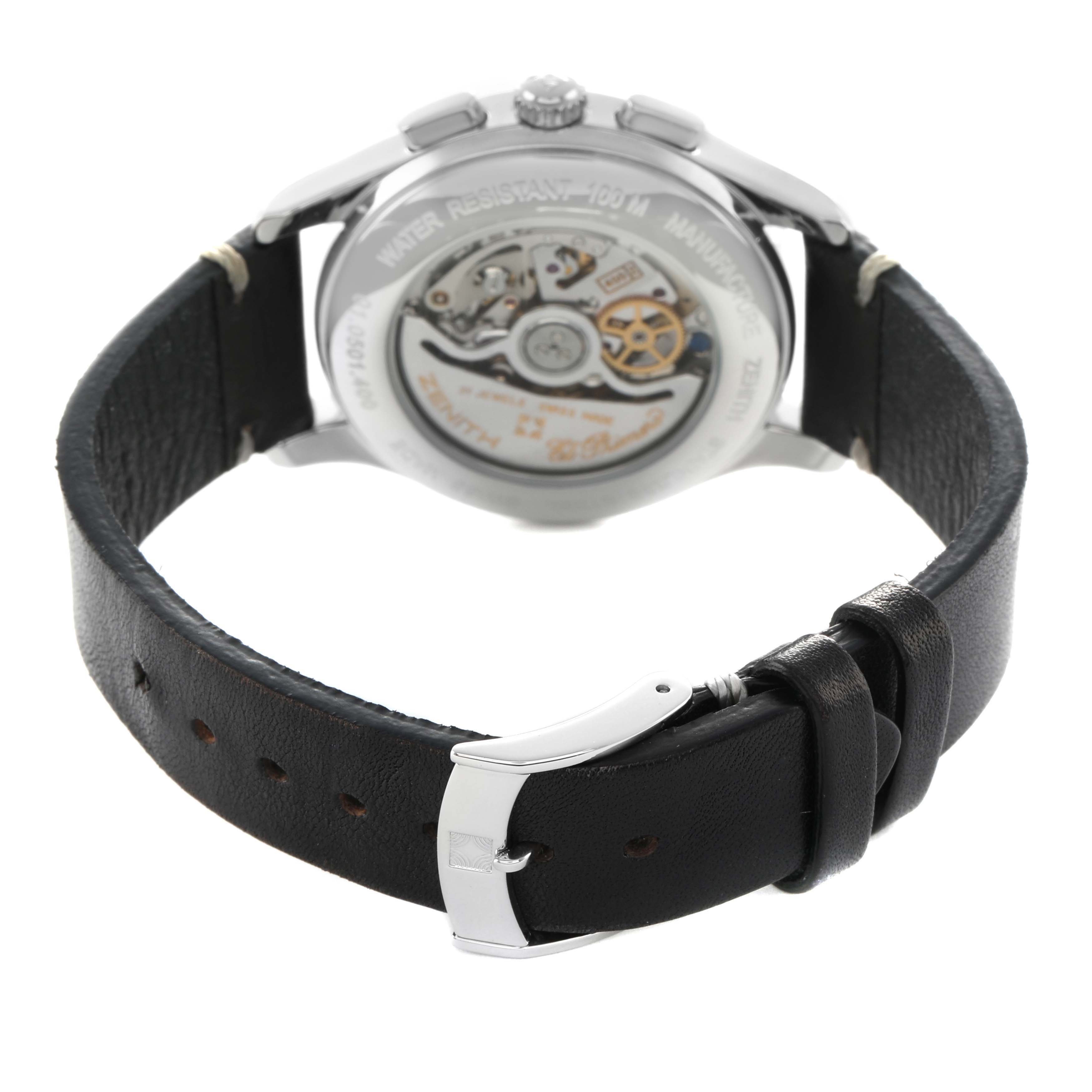 The Zenith El Primero 01.0501.400 Men's Stainless Steel Black Dial watch is shown from the back, highlighting the open case back and leather strap with a buckle.