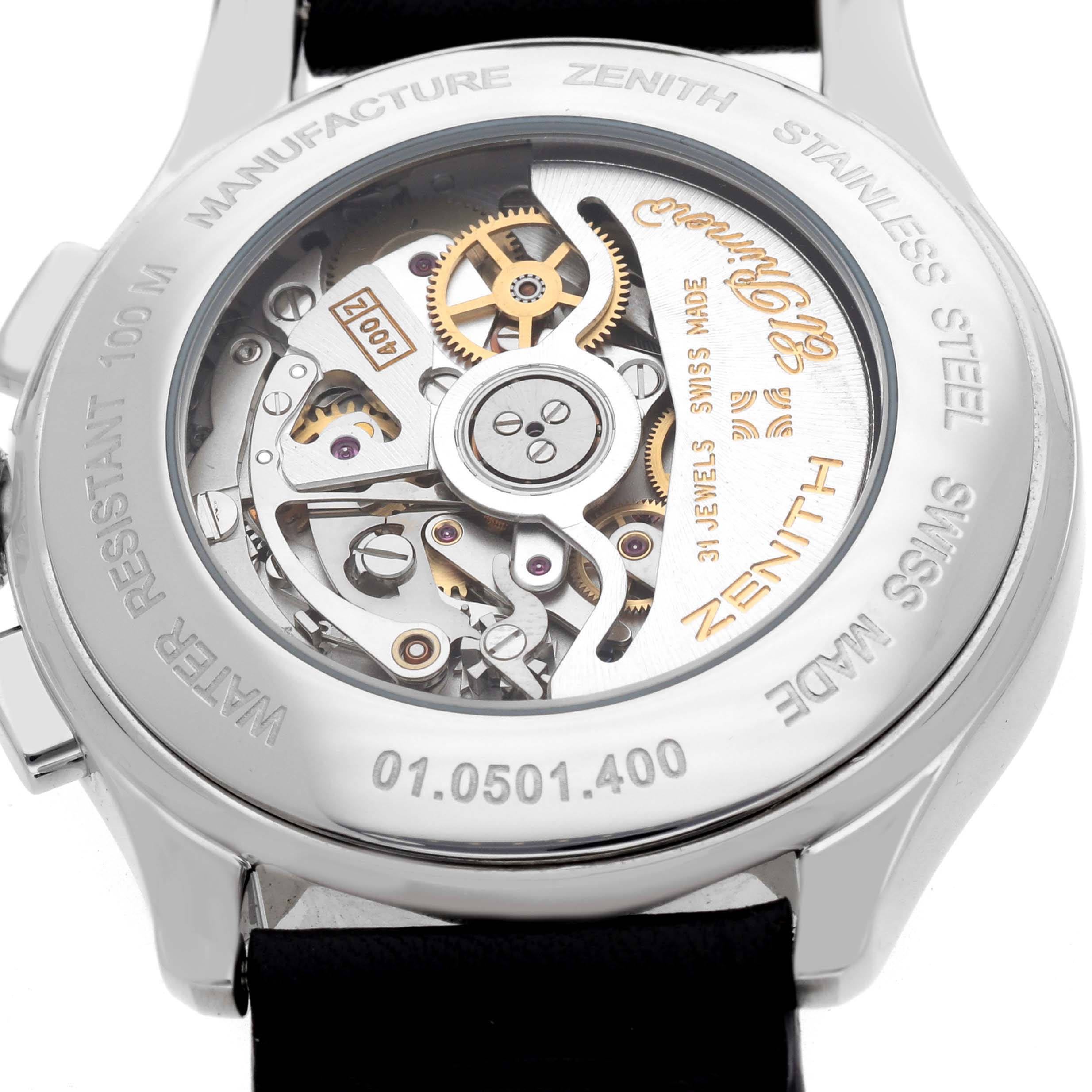The image shows the back of a Zenith El Primero 01.0501.400 Men's Stainless Steel Black Dial watch, displaying its intricate movement and stainless steel casing.
