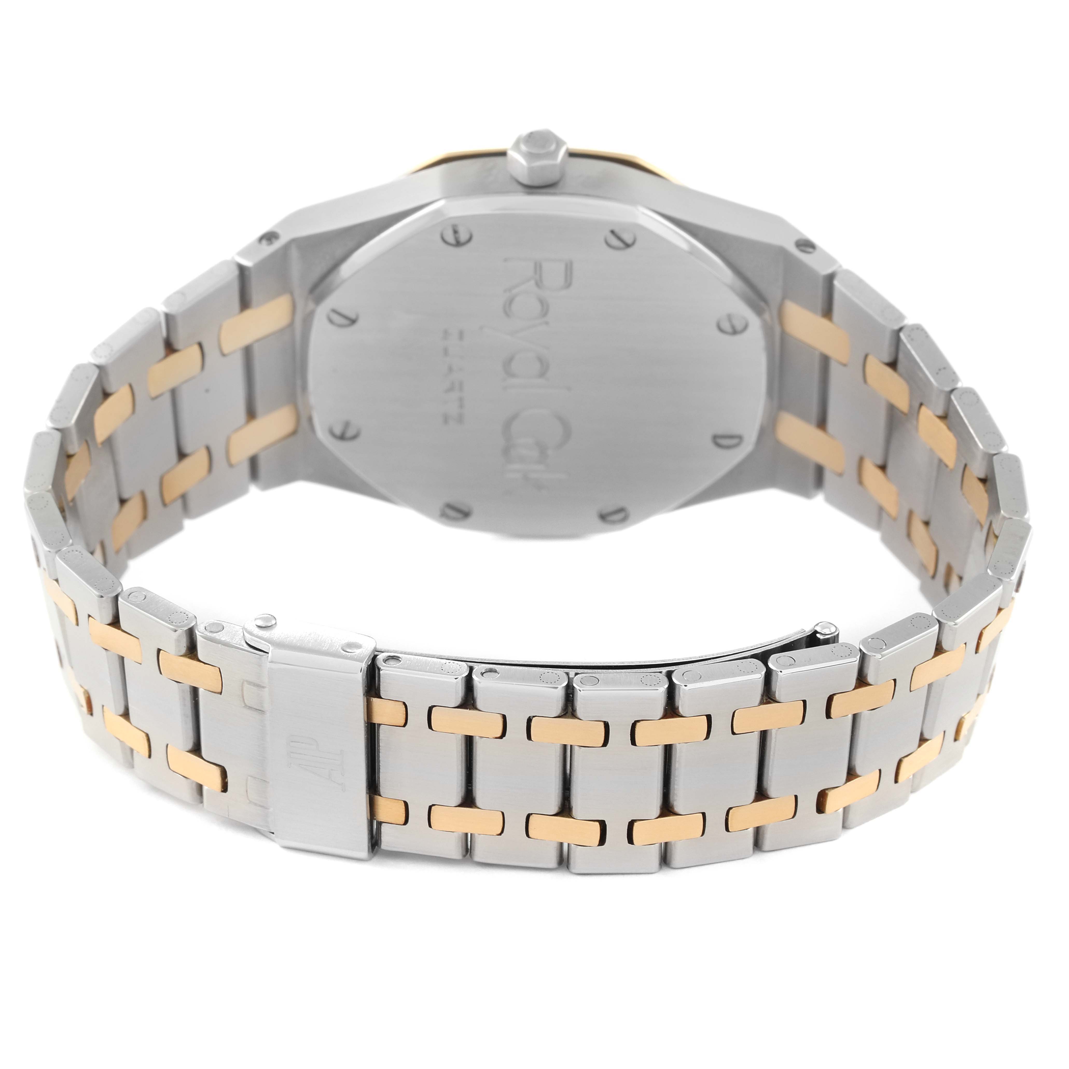 The image shows the back of an Audemars Piguet Royal Oak 6023SA Men's Steel and Gold (two tone) Grey Dial watch, highlighting the case back and two-tone bracelet.
