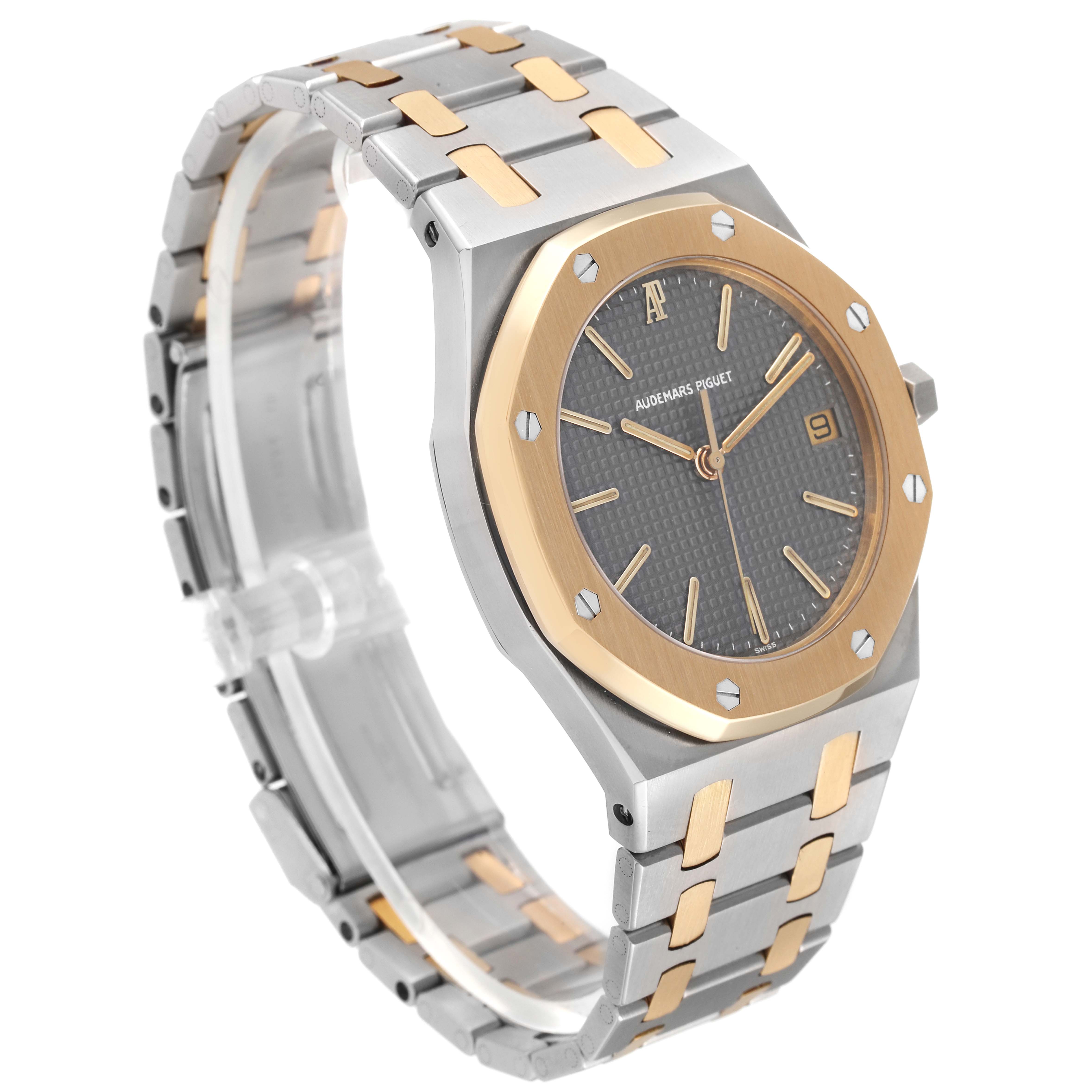 The image shows a side angle of the Audemars Piguet Royal Oak 6023SA Men's Steel and Gold (two tone) Grey Dial, featuring the dial, bezel, and bracelet.