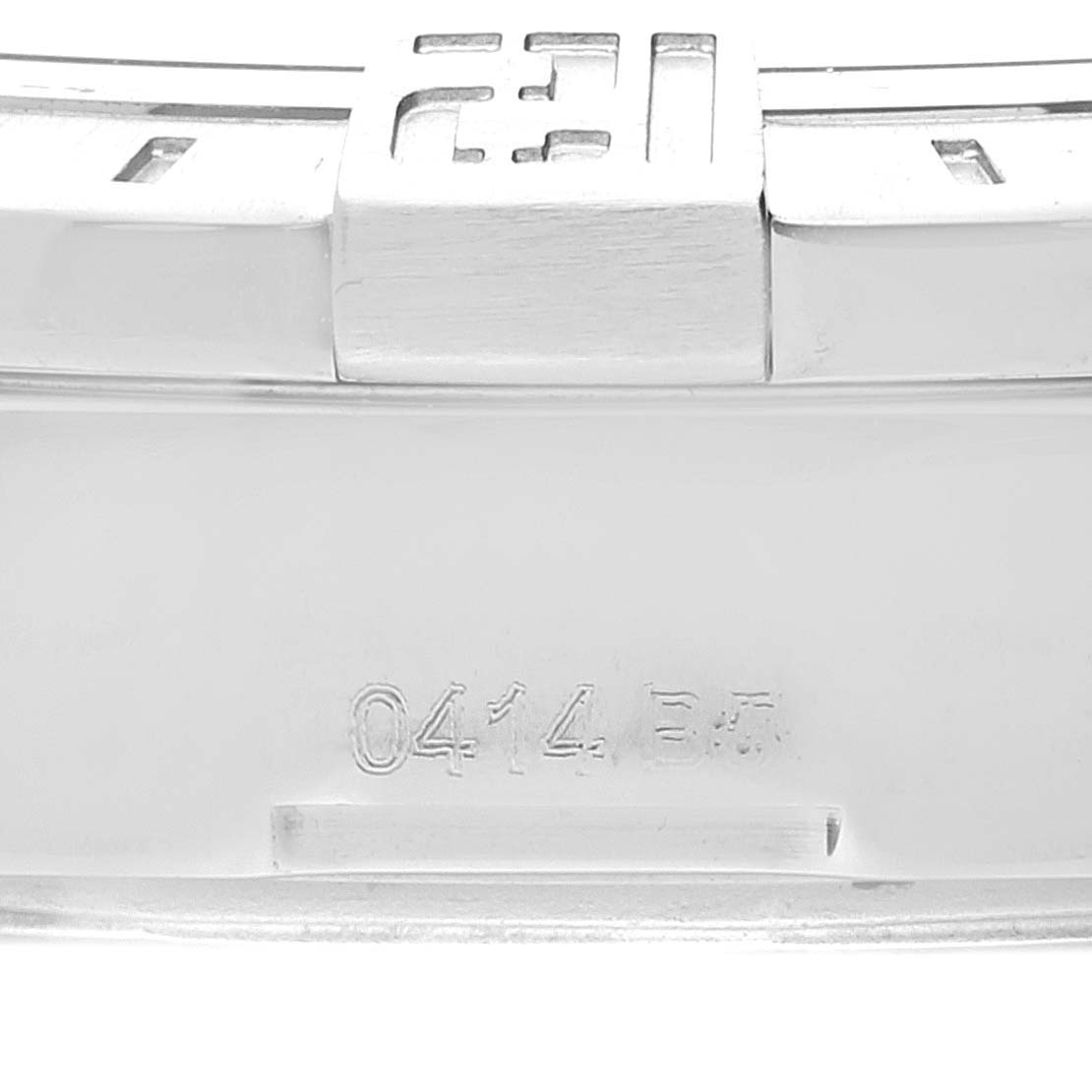 This image shows a close-up of the clasp and backside of the bracelet of a Breitling Avenger A32390 Men's Stainless Steel Black Dial A32390 Men's Stainless Steel Black Dial watch with the number "0414" engraved.