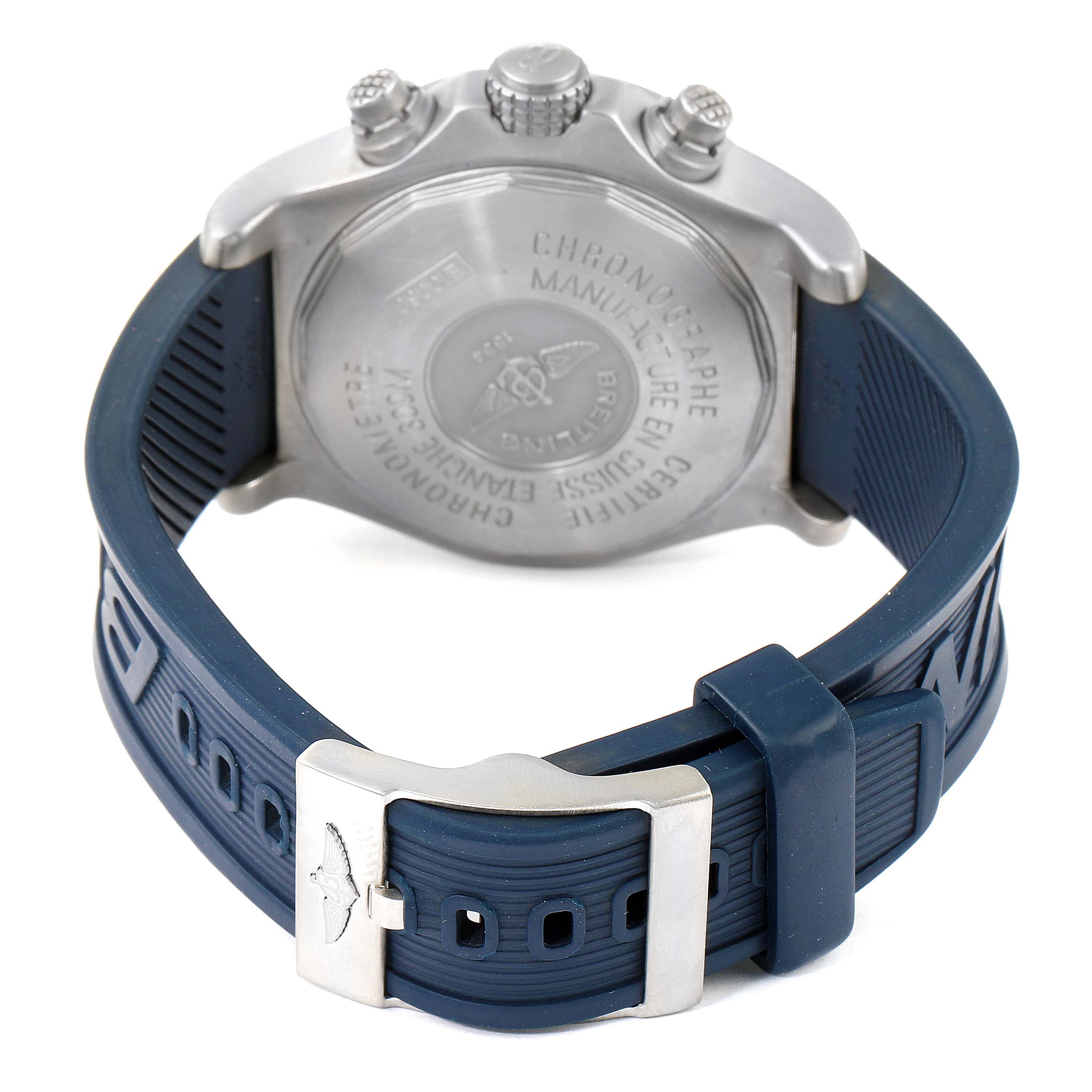 The image shows the back and buckle of a Breitling Avenger E13360 Men's Titanium Blue Dial E13360 Men's Titanium Blue Dial watch with a blue rubber strap.