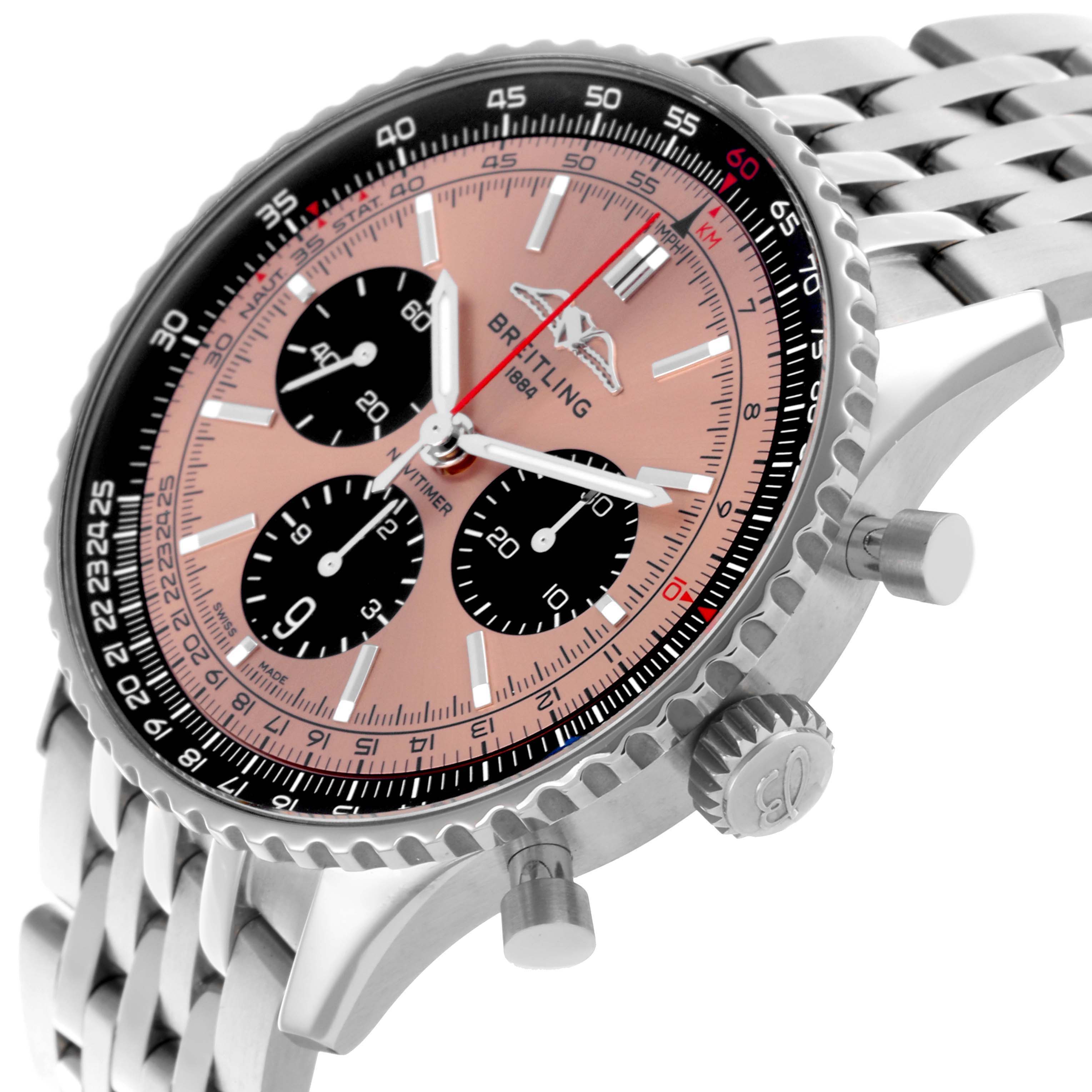 The Breitling Navitimer AB0138 Men's Stainless Steel Pink Dial AB0138 Men's Stainless Steel Pink Dial is shown from an angled side view, displaying the face, crown, pushers, and partial bracelet.