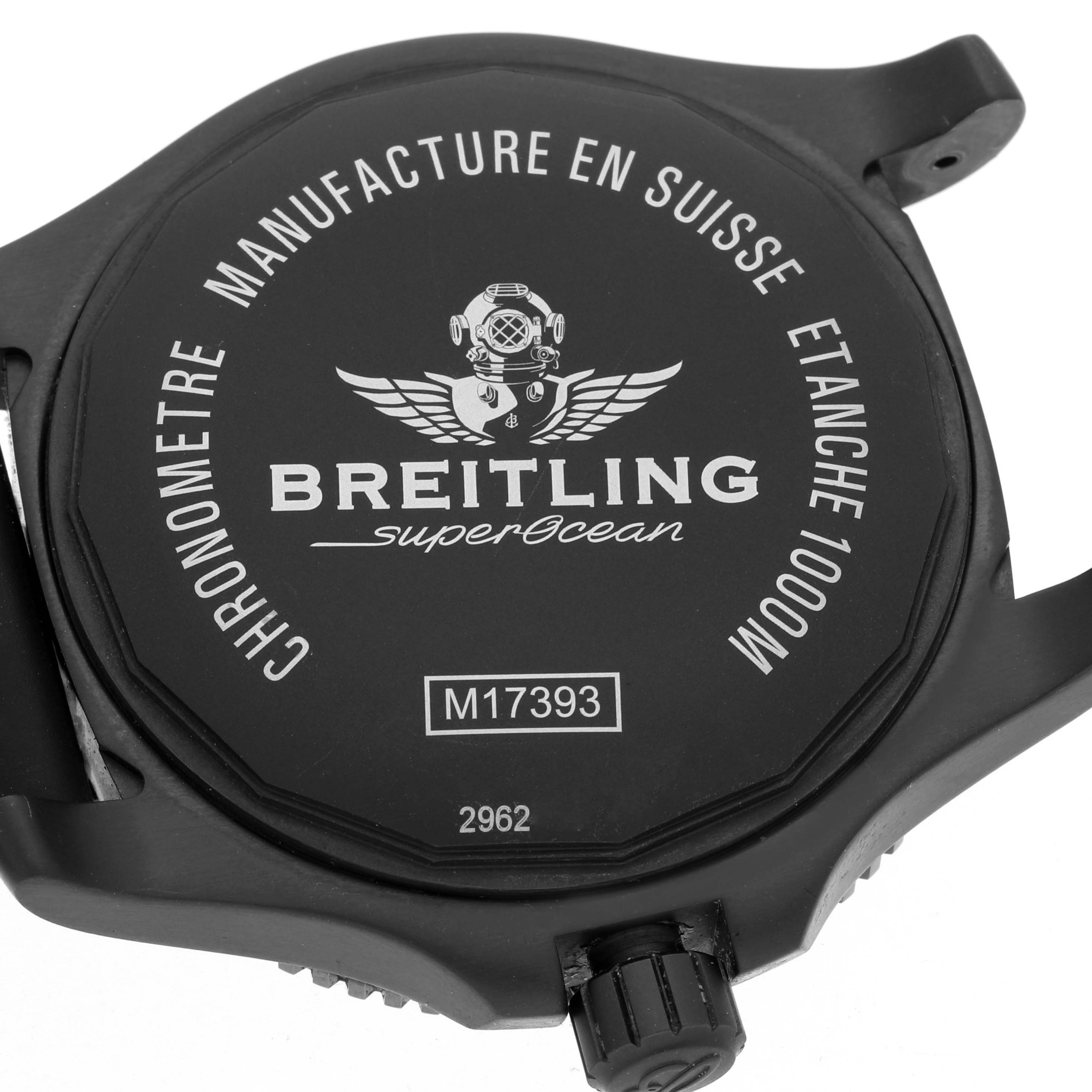 The image shows the back case of a Breitling Superocean M17393 Men's Stainless Steel Black Dial watch with inscriptions and the crown partially visible.