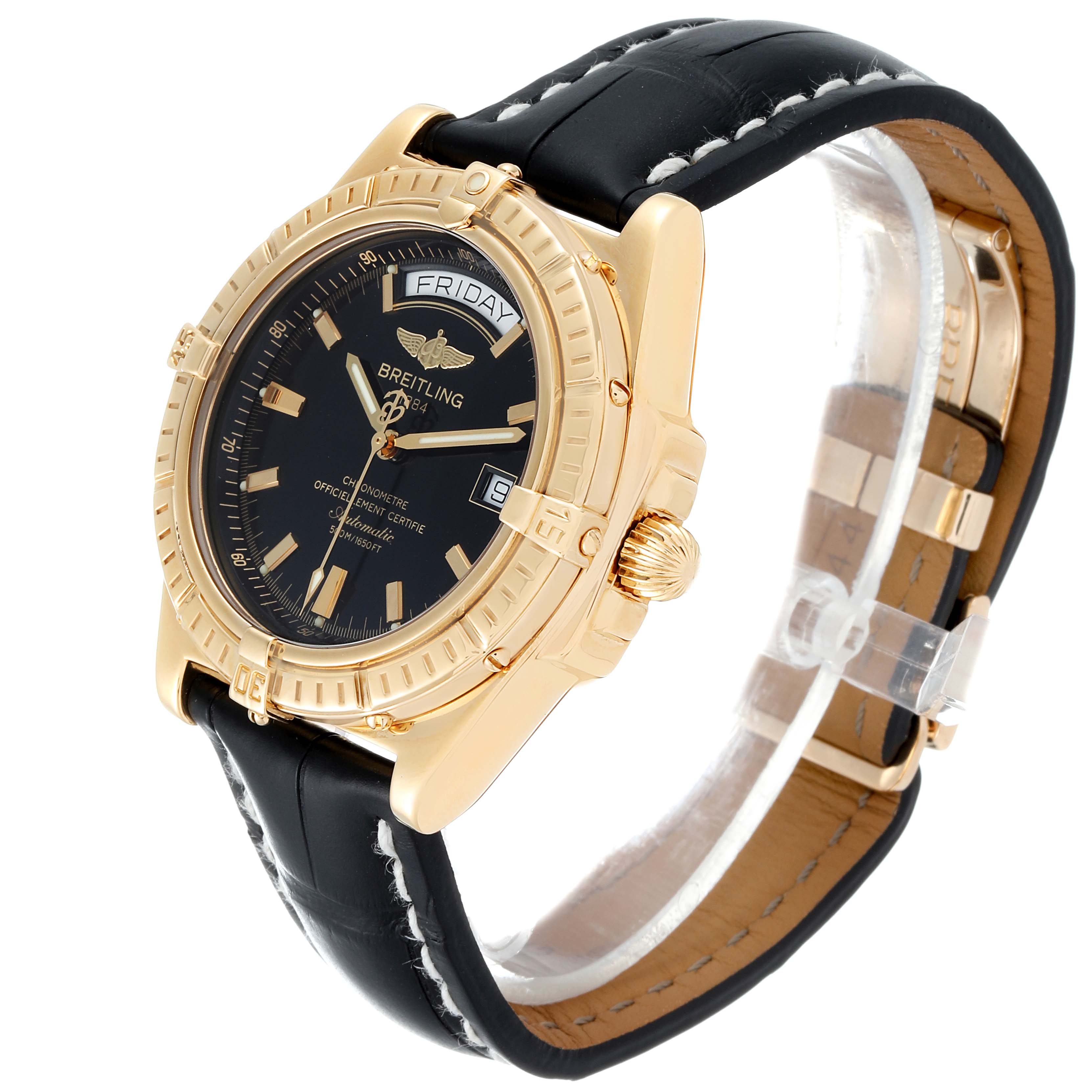 The image shows a Breitling Windrider K45355 Men's Yellow Gold Black Dial K45355 Men's Yellow Gold Black Dial watch at a 3/4 angle displaying its black dial, gold case, leather strap, and crown.