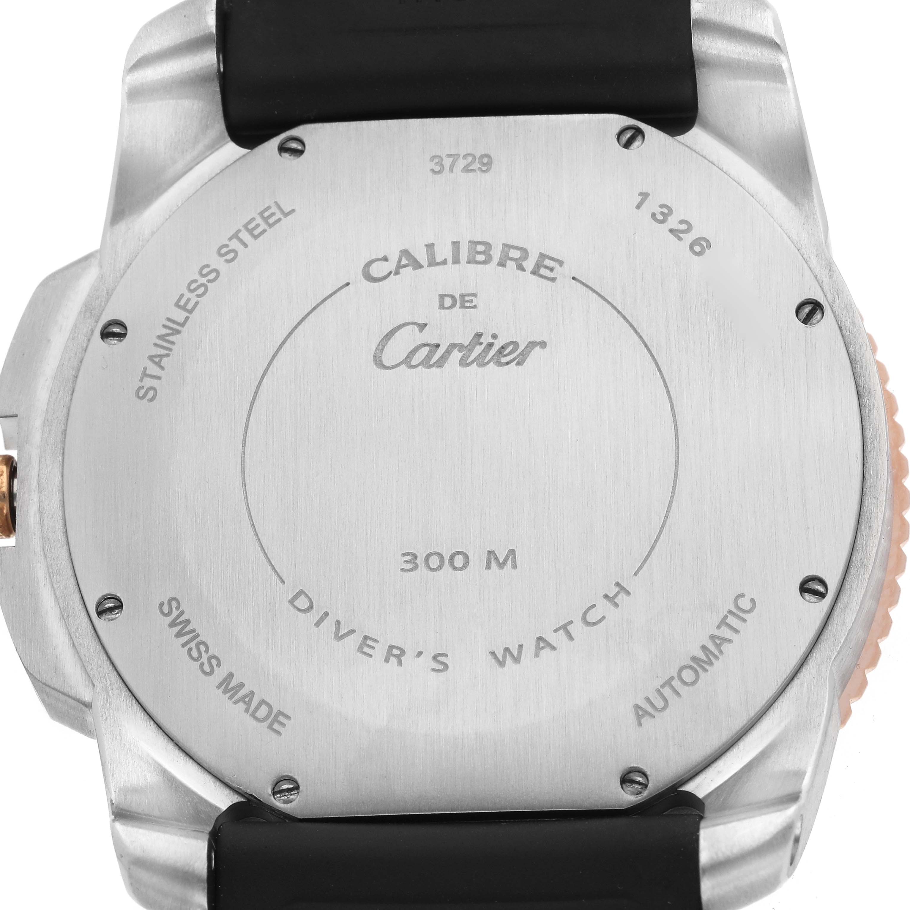 The image shows the back of a Calibre de Cartier watch by Cartier, including the caseback details and strap attachment.