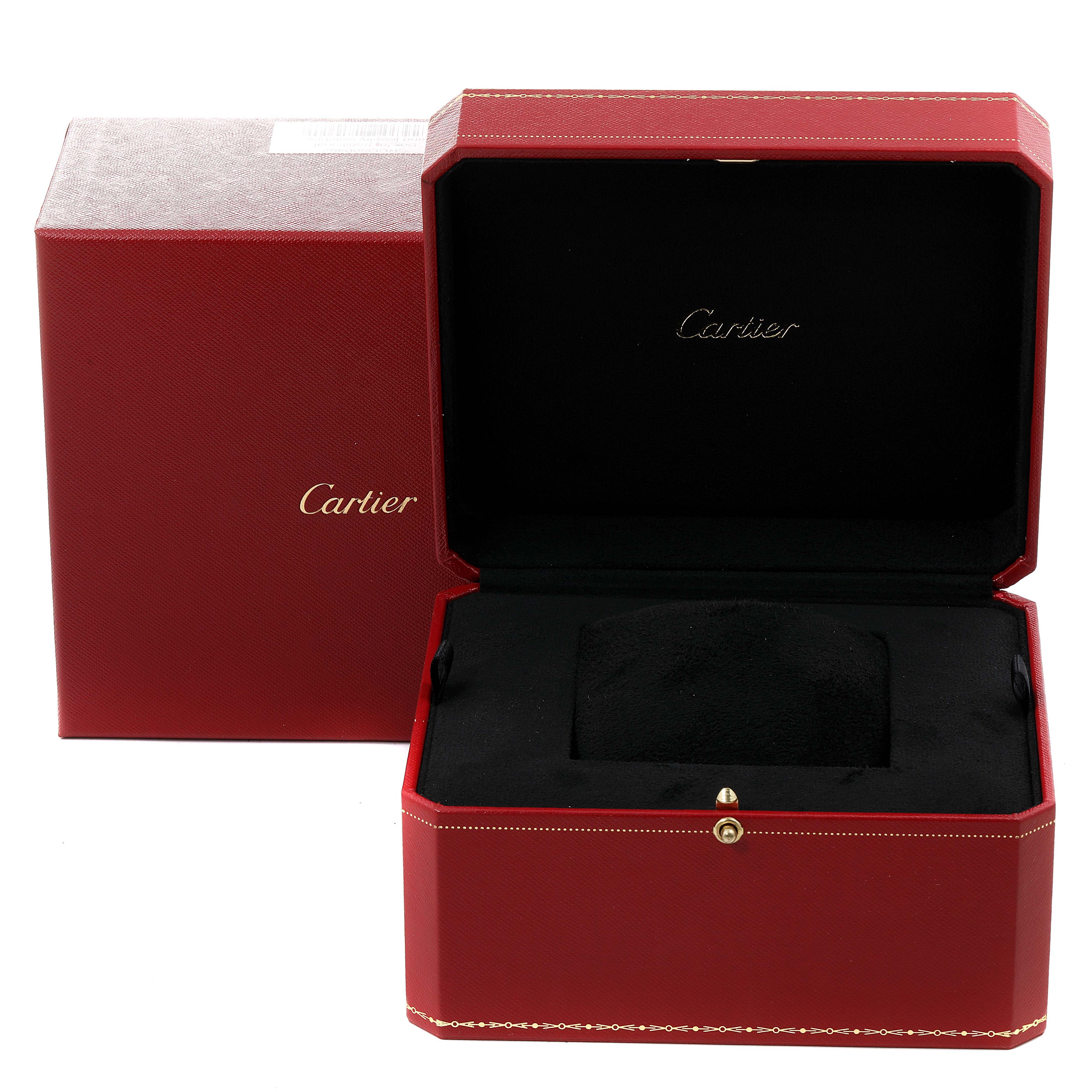 The image shows an open Cartier Cle WGCL0004 Men's Rose Gold Silver Dial WGCL0004 Men's Rose Gold Silver Dial model watch box with black interior padding and a red exterior.