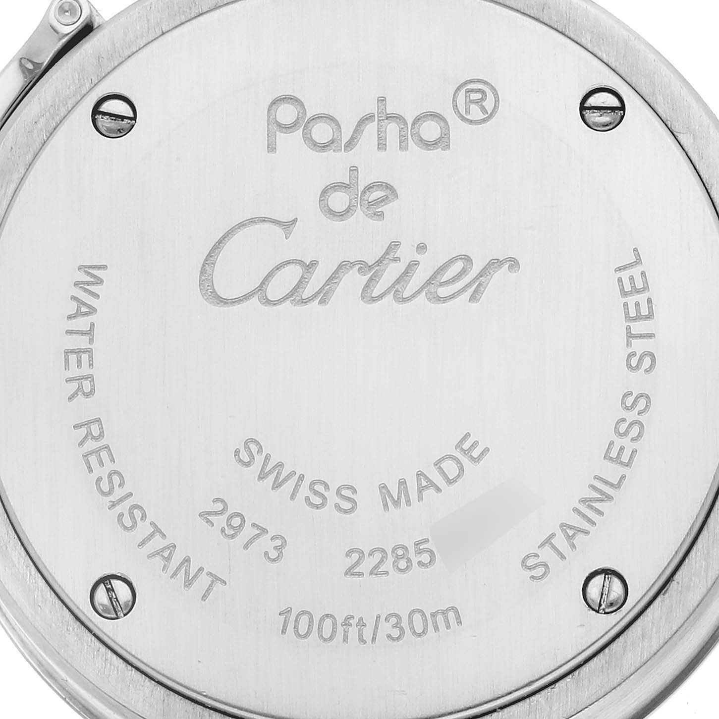The image shows the back of the Cartier Pasha W3140007 Women
s Stainless Steel Silver Dial W3140007 Women
s Stainless Steel Silver Dial watch, highlighting engravings and screw details.