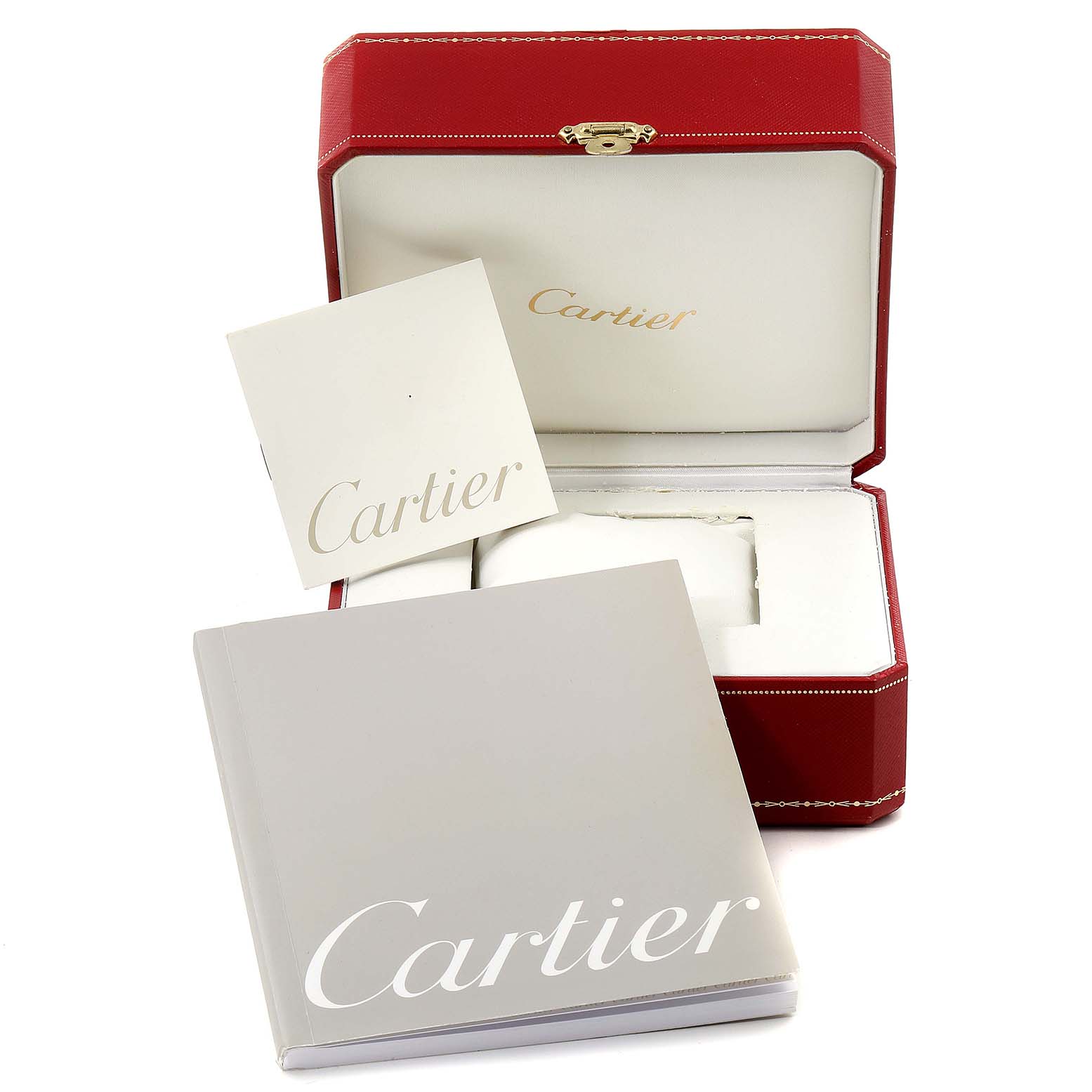 The image shows an open red Cartier box for a Roadster model, a warranty or instruction booklet, and a Cartier catalog.