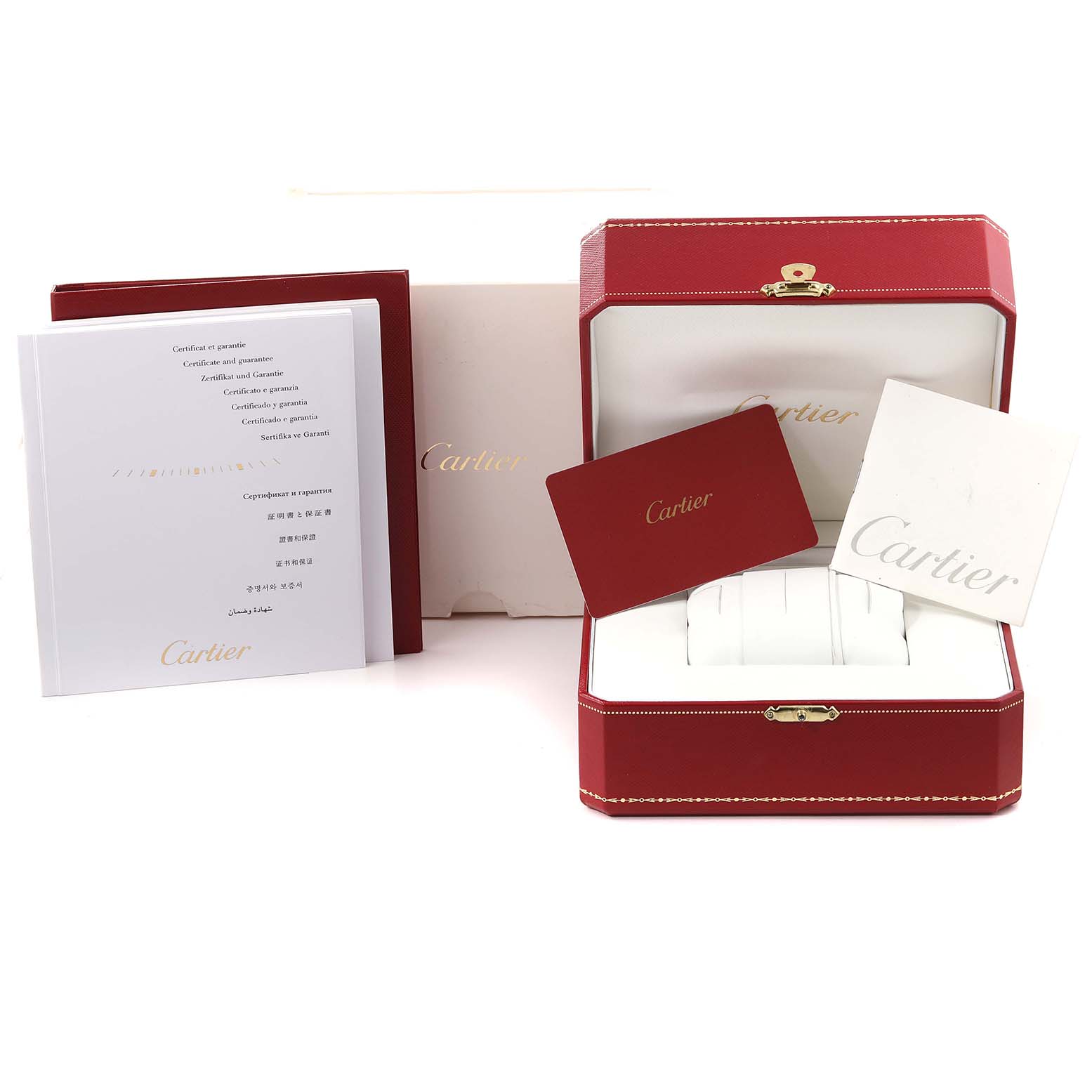 The image shows the packaging and accessories for the Ronde model by Cartier, including the box, certificates, and manuals.