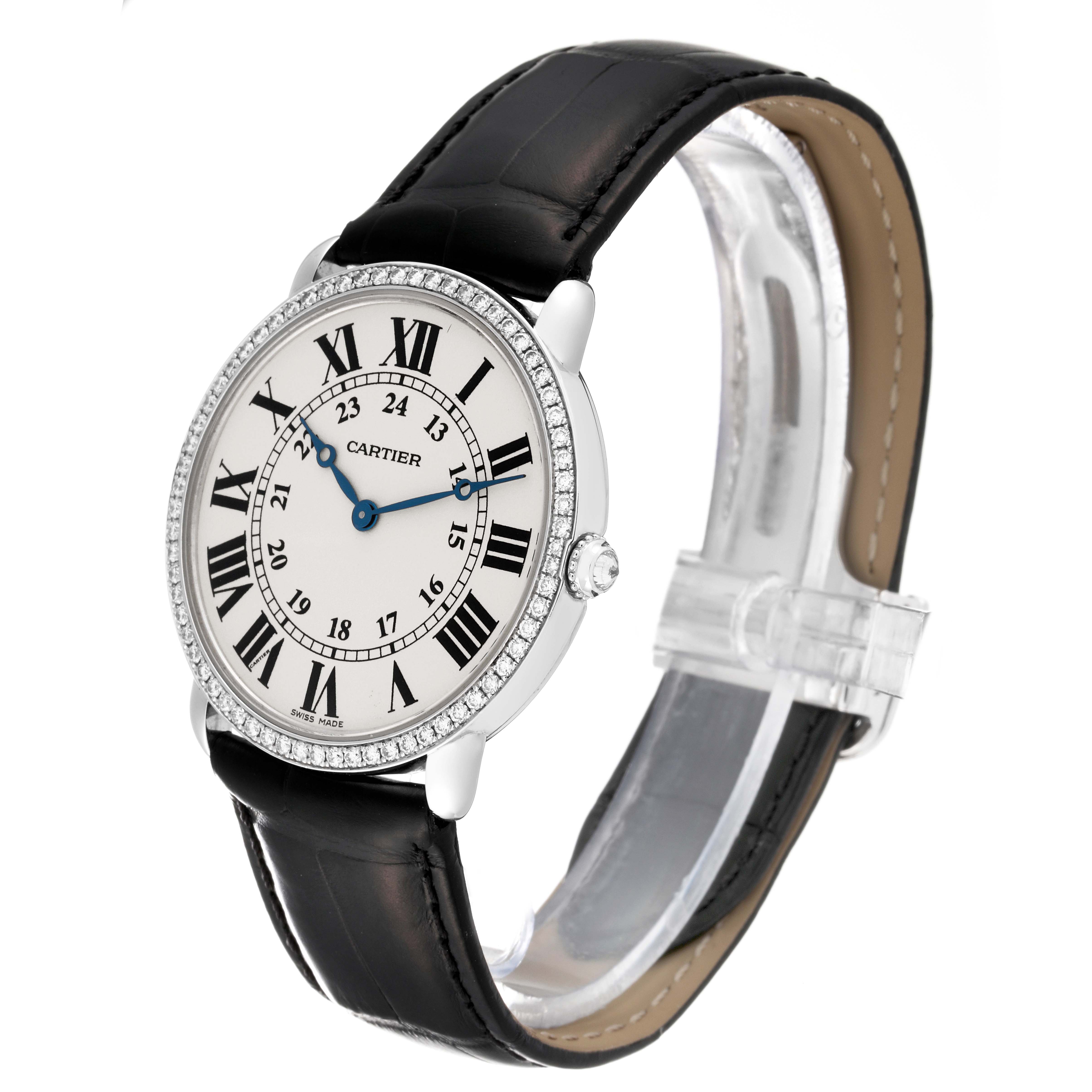 The Cartier Ronde WR000551 Men's White Gold Silver Dial WR000551 Men's White Gold Silver Dial watch shown at an angle highlights the face, bezel, crown, and leather strap.