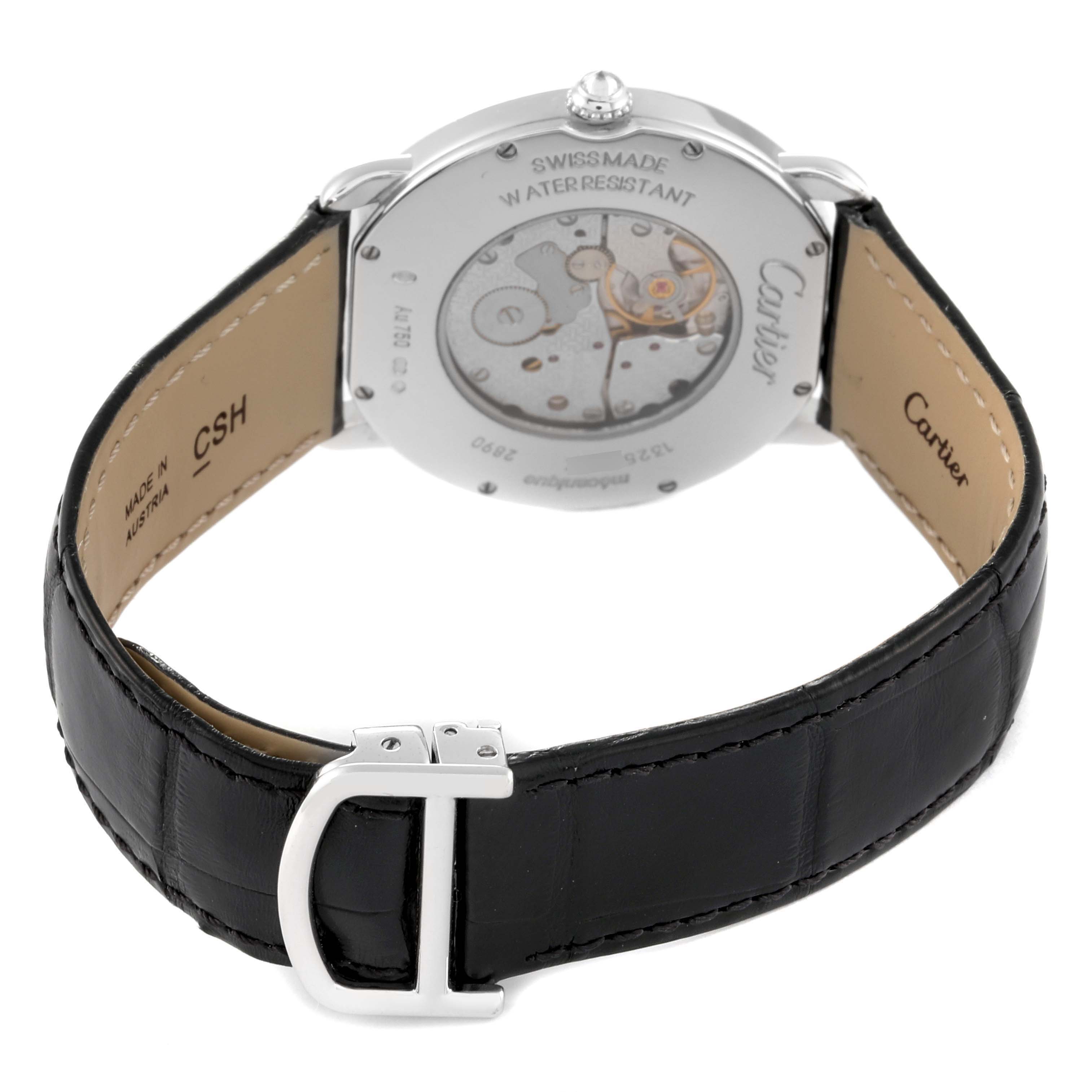 The image shows the backside and movement of the Cartier Ronde WR000551 Men's White Gold Silver Dial WR000551 Men's White Gold Silver Dial model watch, along with its black leather strap and clasp.