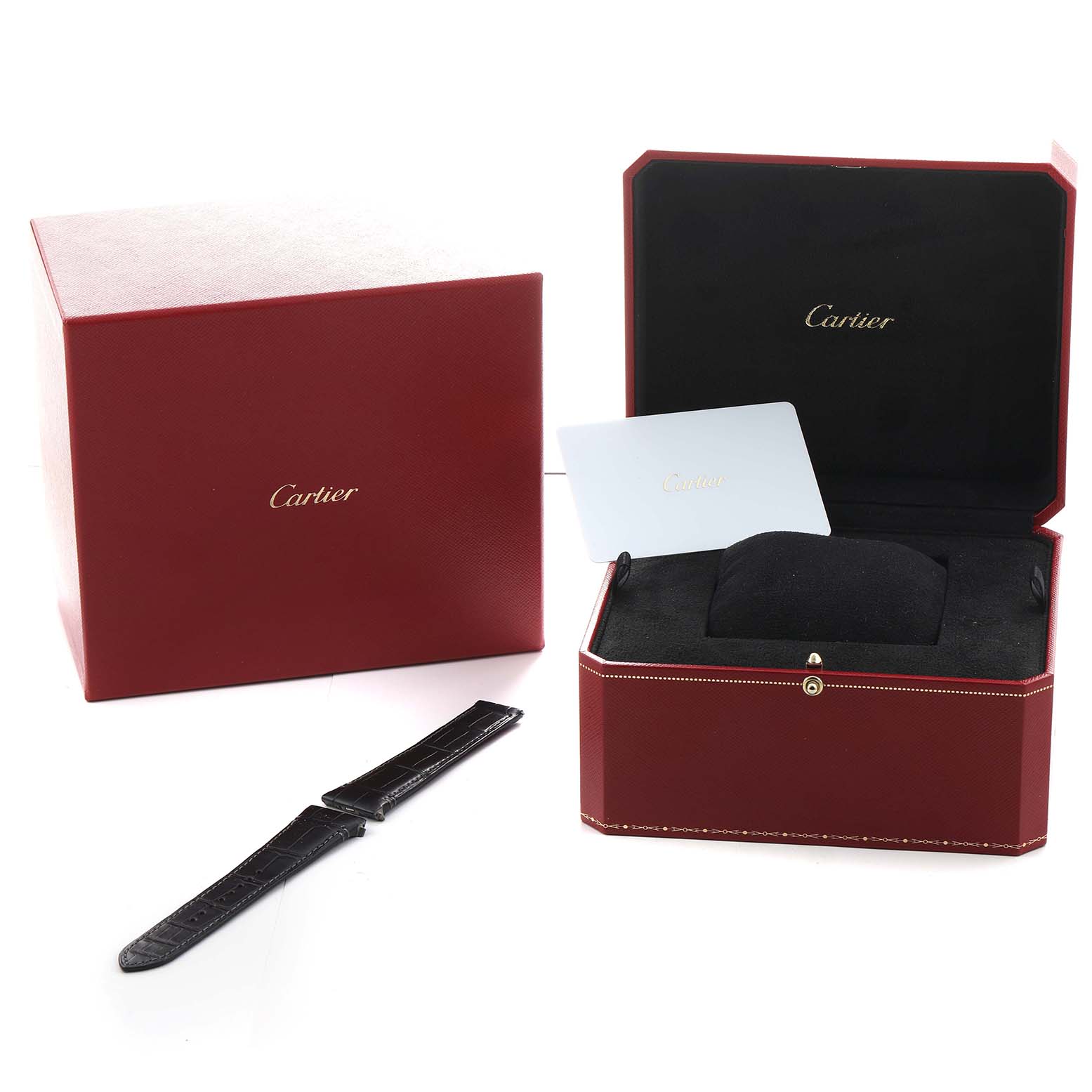 The image shows the Cartier Santos Dumont WSSA0039 Men's Stainless Steel Black Dial watch accessories, including a red box, a leather strap, and a card at an angle.