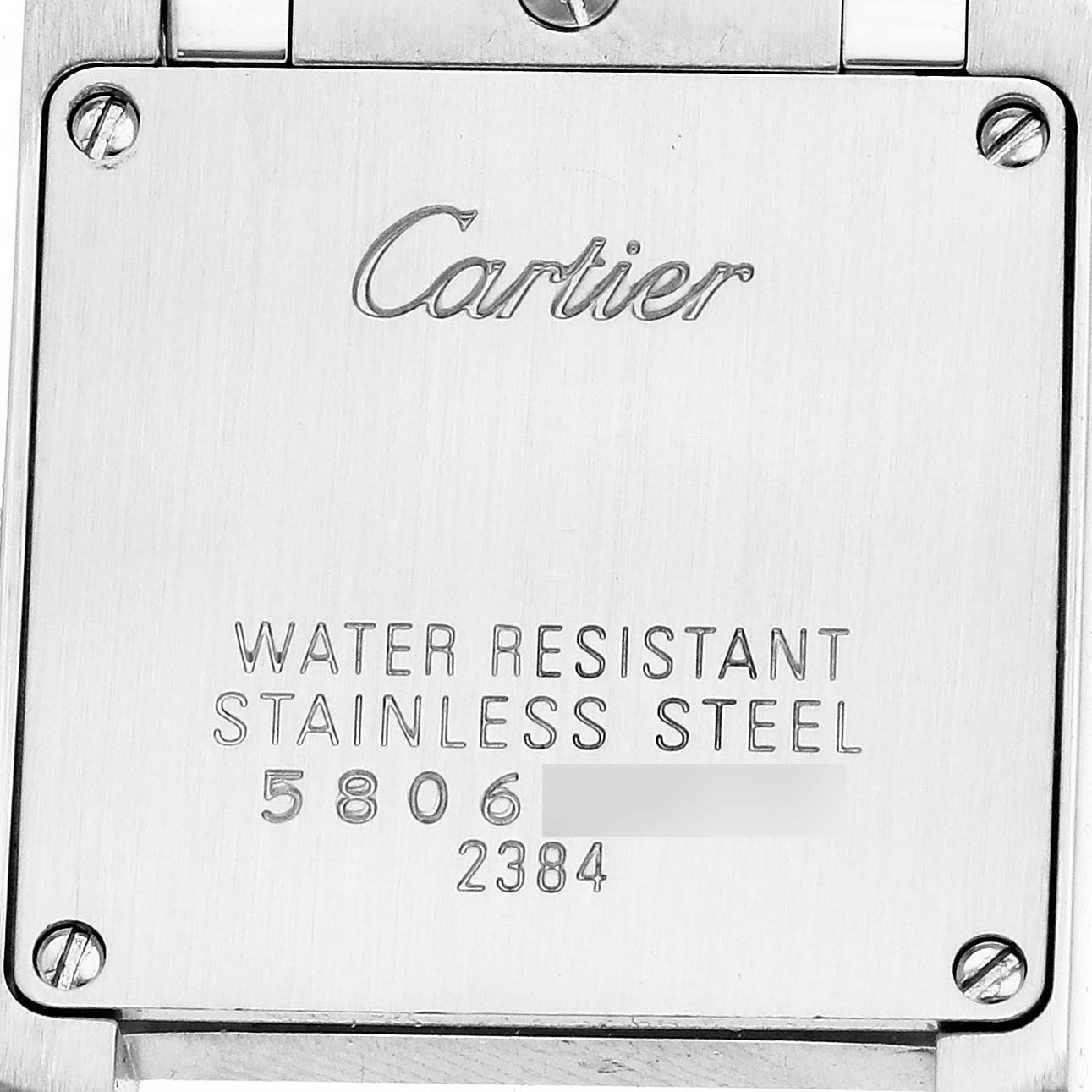 The image shows the back of a Cartier Tank Francaise W51008Q3 Women's Stainless Steel Silver Dial watch, highlighting its case engraving with water resistance and material details.