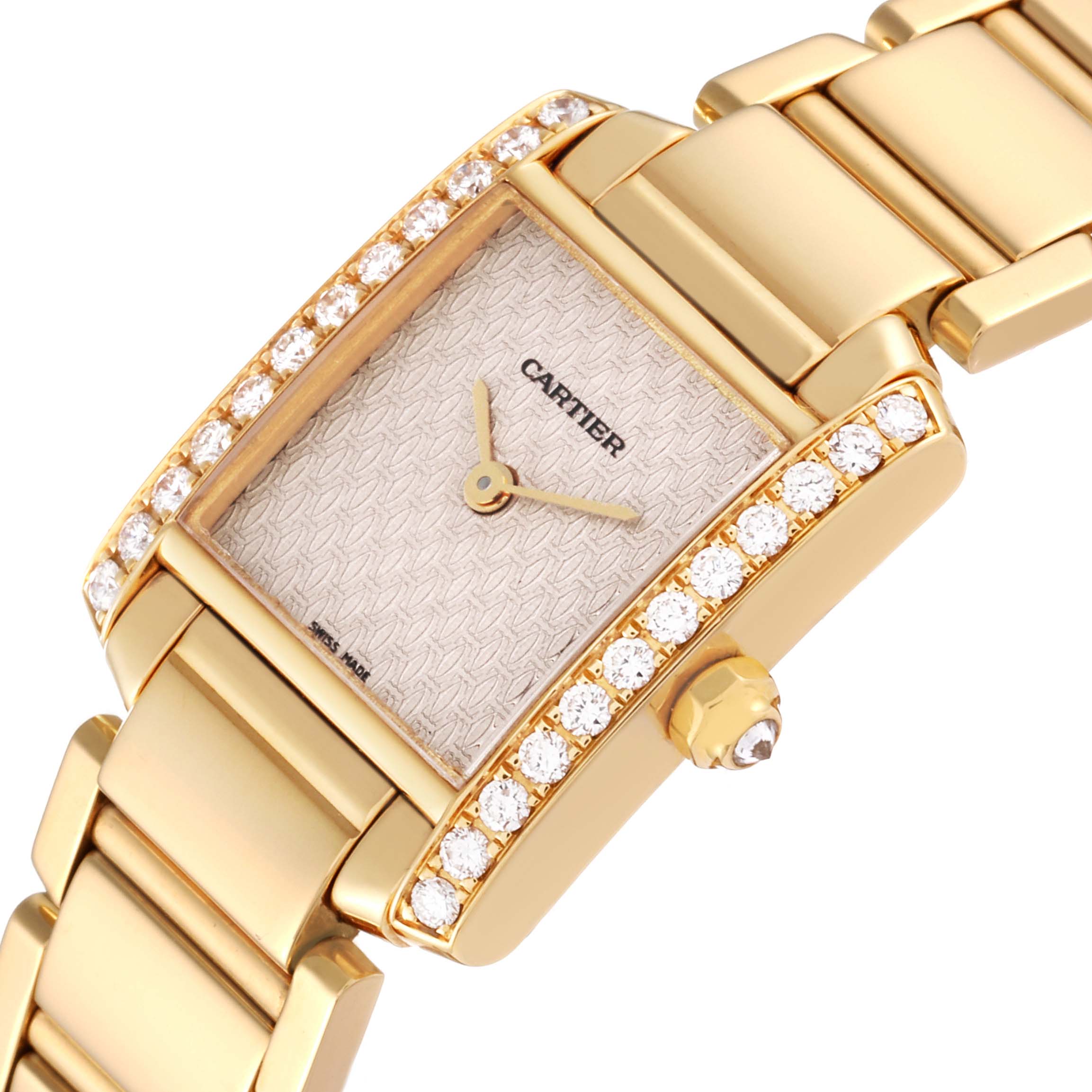 The Cartier Tank Francaise WE1021R8 Women's Yellow Gold Pink Dial WE1021R8 Women's Yellow Gold Pink Dial watch is shown at an angled close-up, highlighting its diamond bezel and part of its gold bracelet.