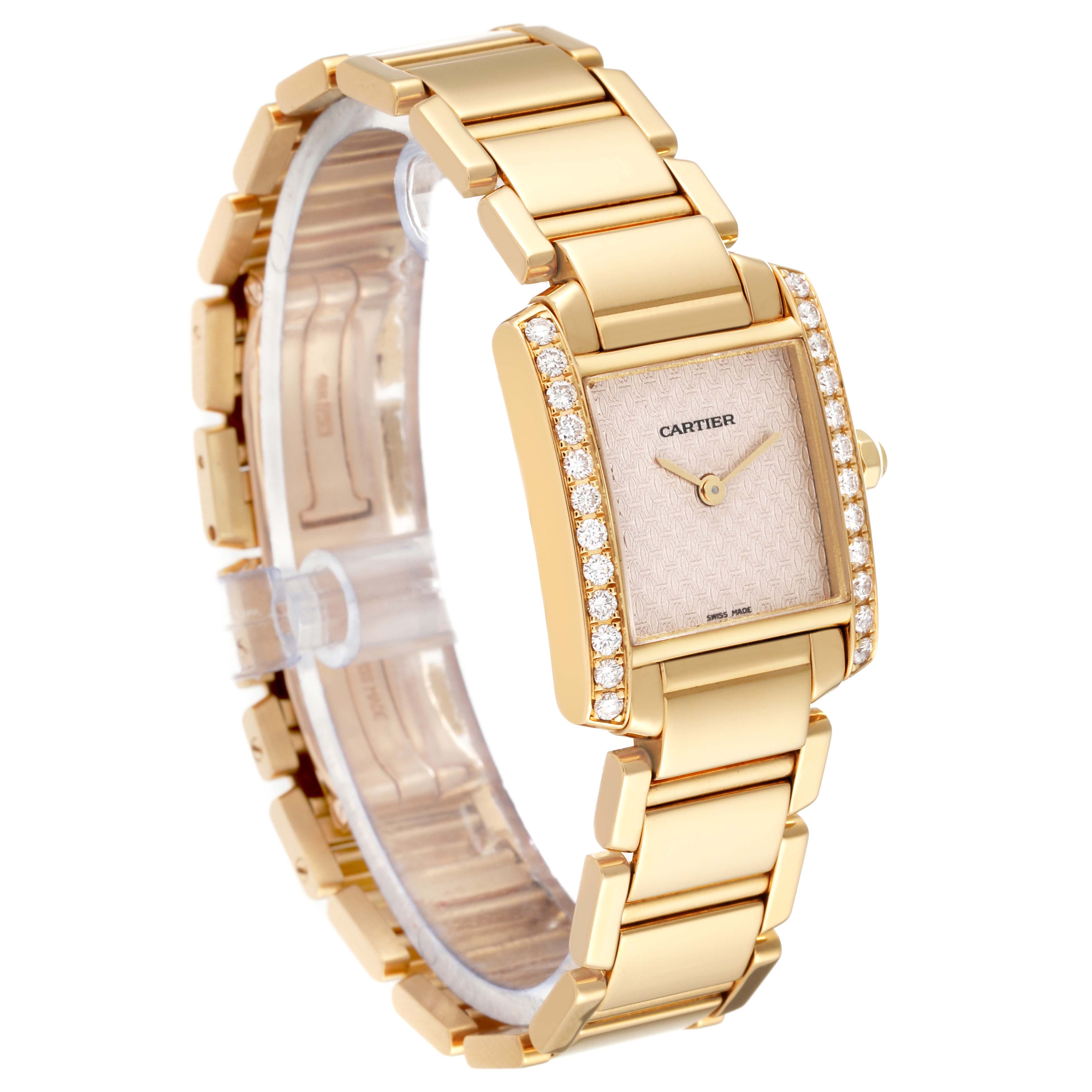The image shows a Cartier Tank Française watch at a three-quarter angle, highlighting its gold bracelet and diamond-accented bezel.