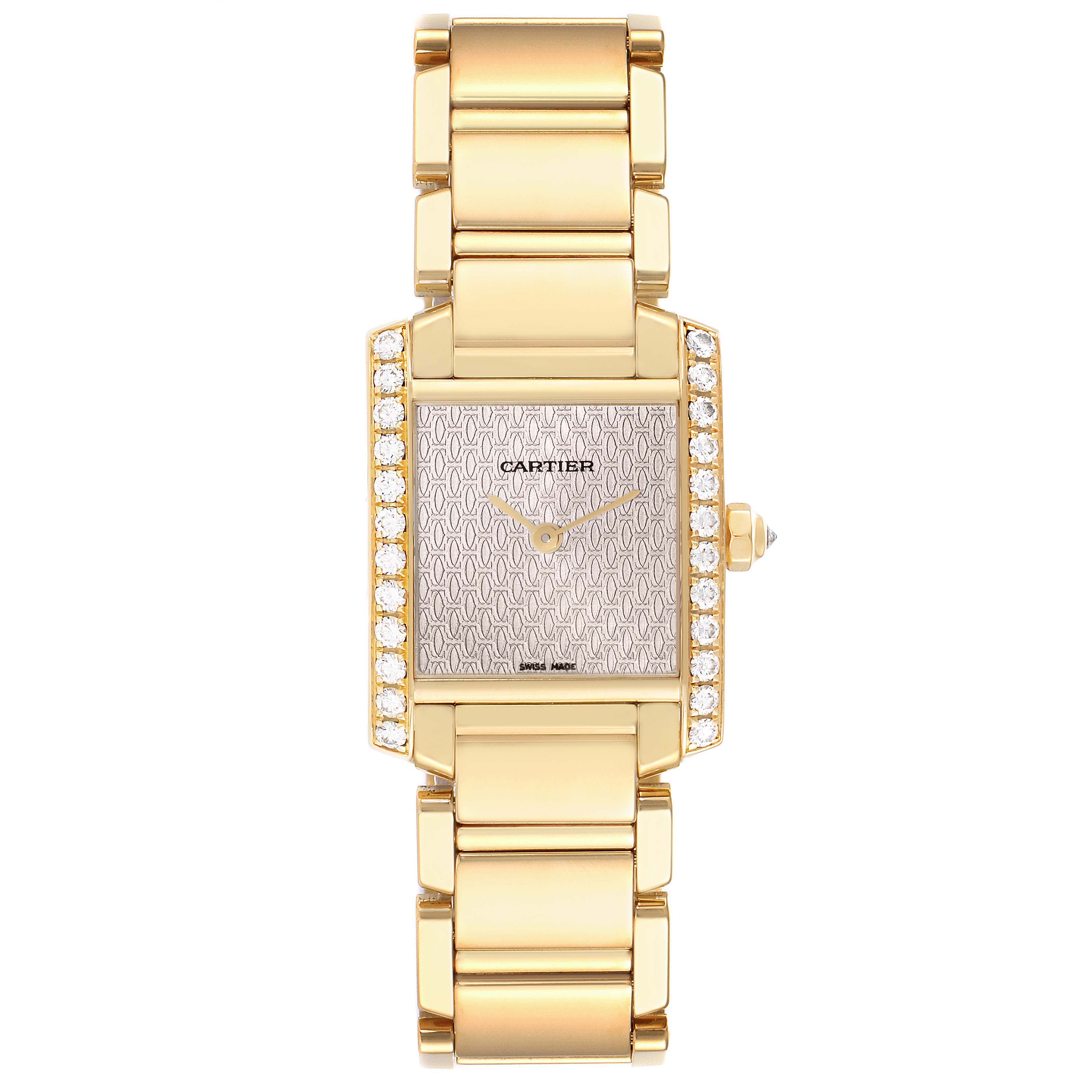 The image shows a top-down view of a Cartier Tank Francaise WE1021R8 Women's Yellow Gold Pink Dial WE1021R8 Women's Yellow Gold Pink Dial watch, highlighting its rectangular face, gold bracelet, and diamond accents.