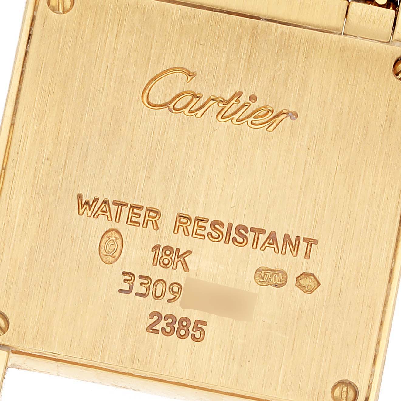 This is the back of the Cartier Tank Francaise WE1021R8 Women's Yellow Gold Pink Dial WE1021R8 Women's Yellow Gold Pink Dial watch, showing the brand engraving and specifications like water resistance and 18K gold.