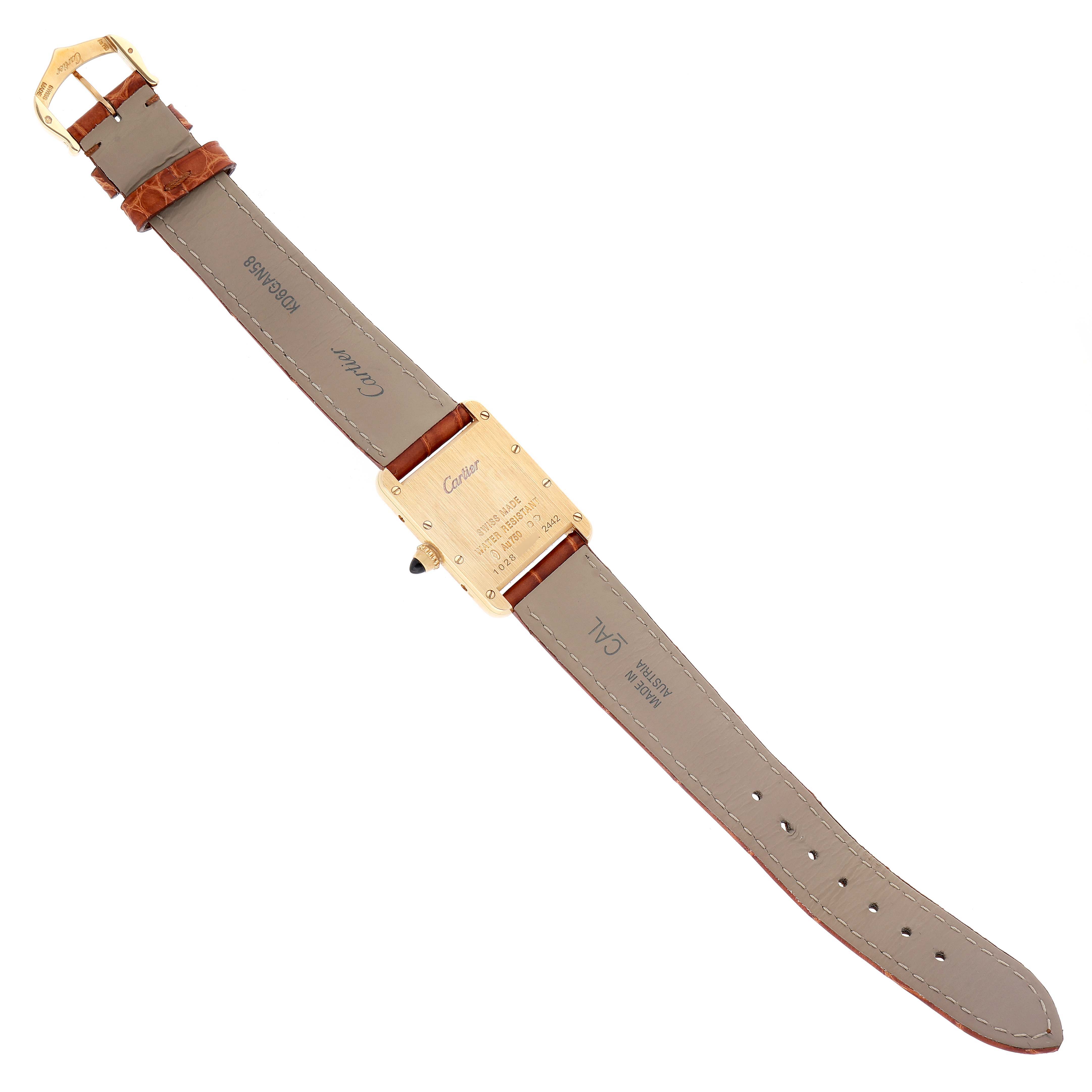 This Tank Louis model by Cartier is shown from the back, detailing the case back and leather strap.