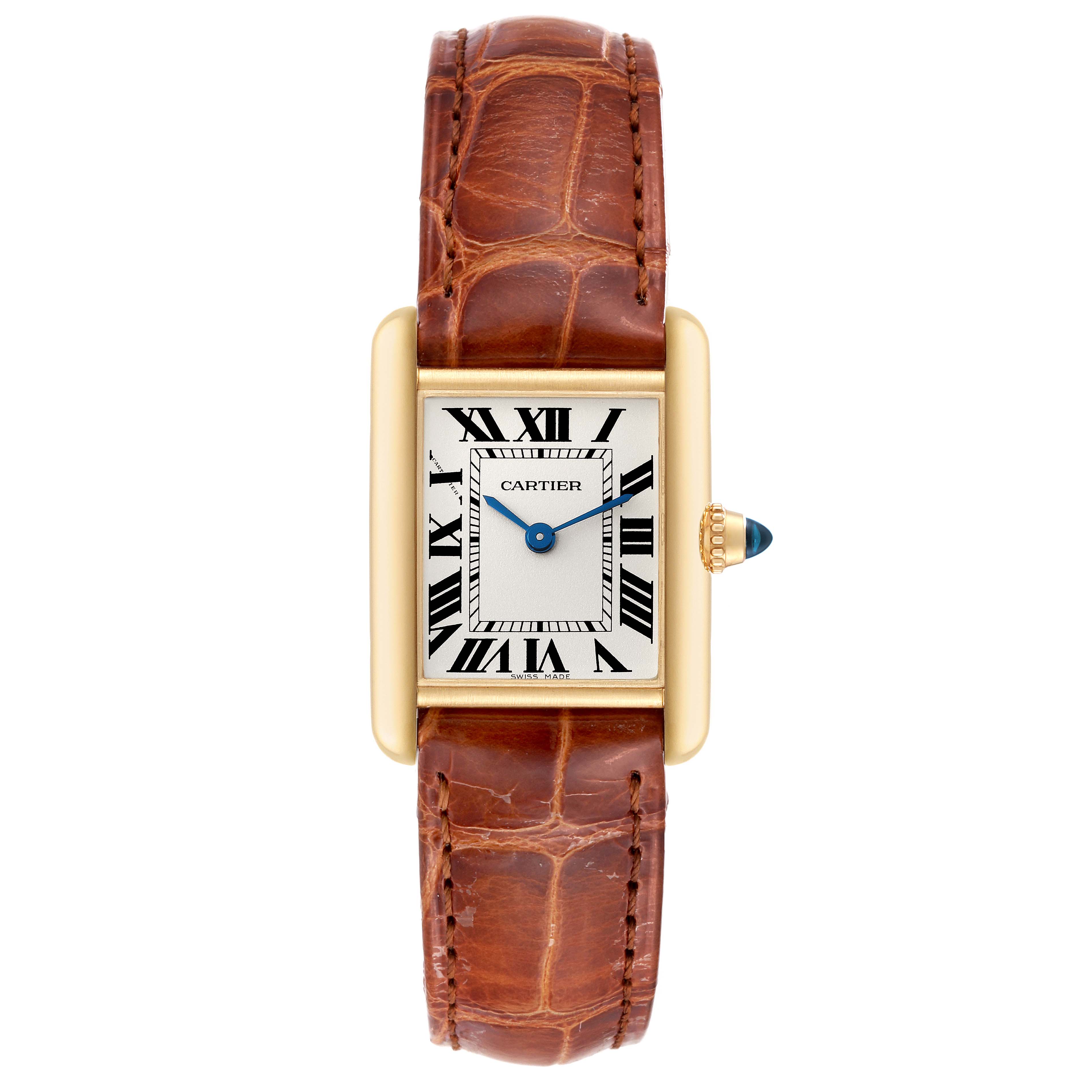 A Tank Louis by Cartier watch is shown fully from a top-down angle, highlighting its brown leather strap, rectangular gold case, and white dial with Roman numerals.