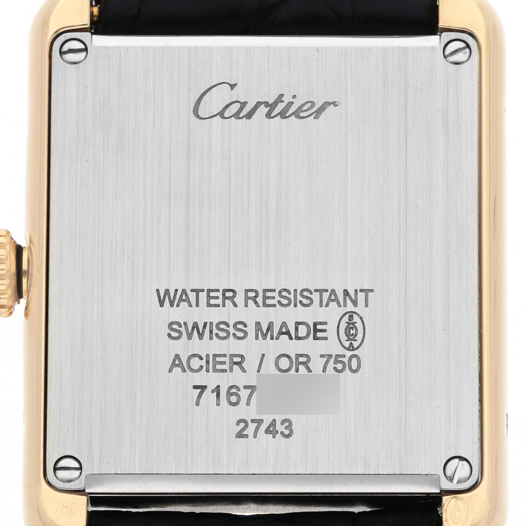 The image shows the back case of the Cartier Tank Solo W1018755 Women's Yellow Gold Silver Dial watch, featuring the crown and engraved specifications.